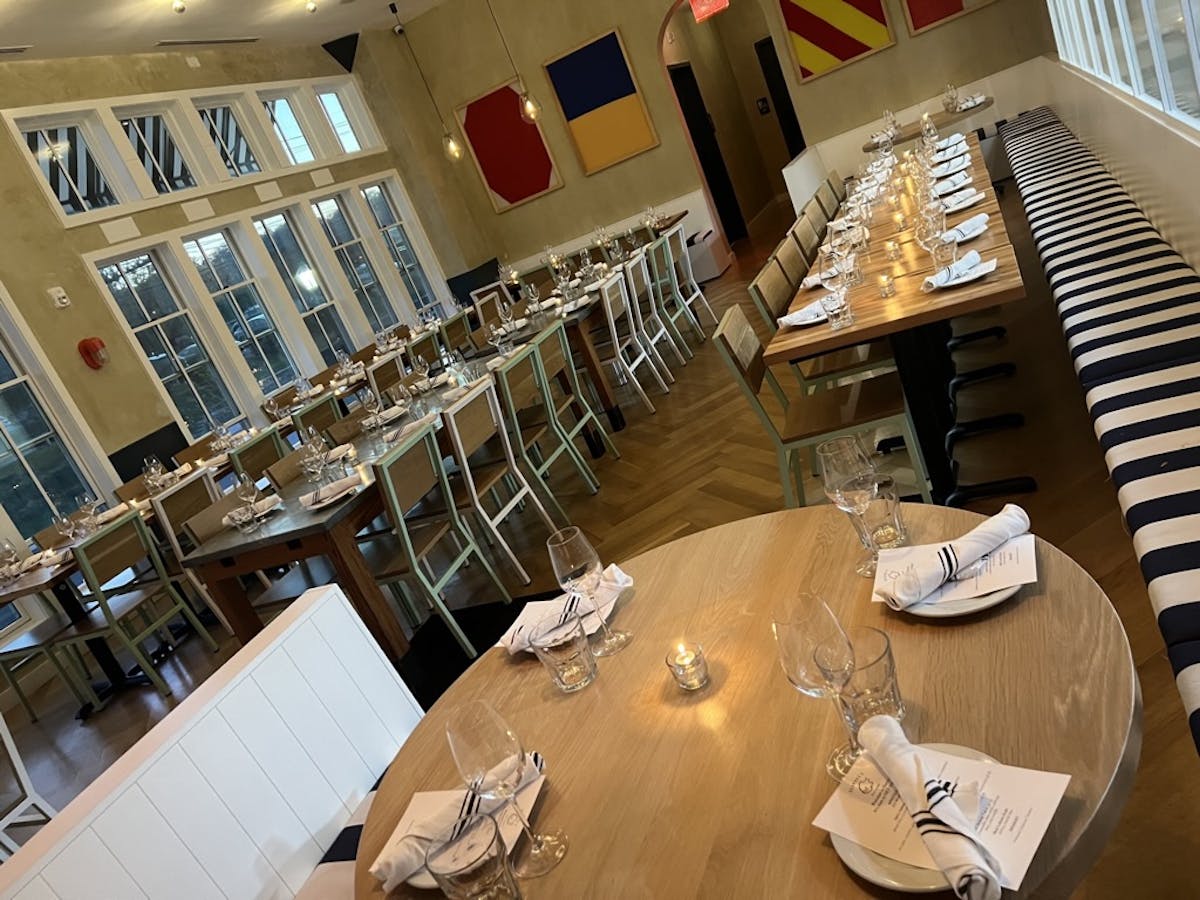 a person sitting at a table in a restaurant