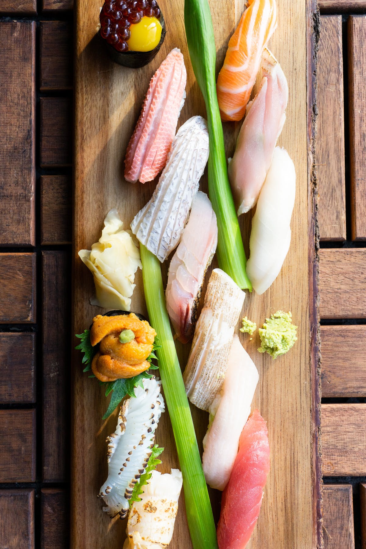 sushi sitting on top of a wooden table