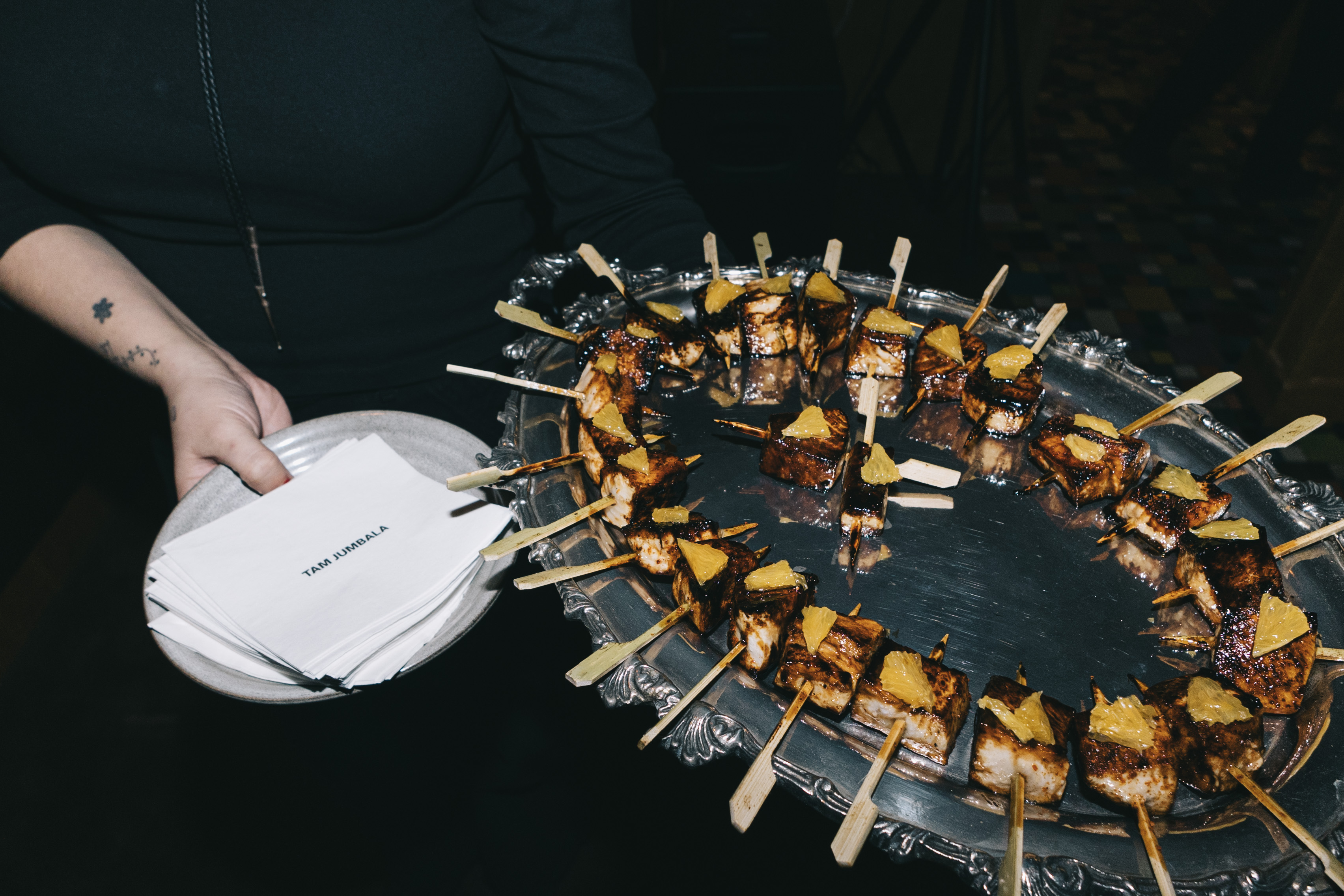 a person holding a plate of food