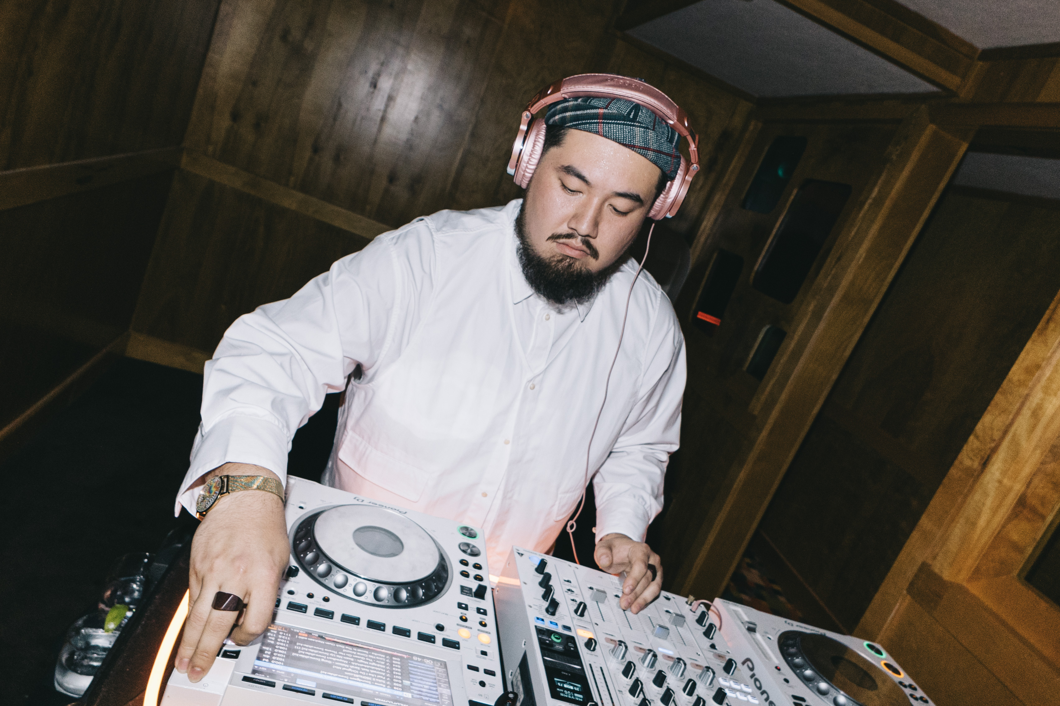 a man wearing headphones and a white shirt