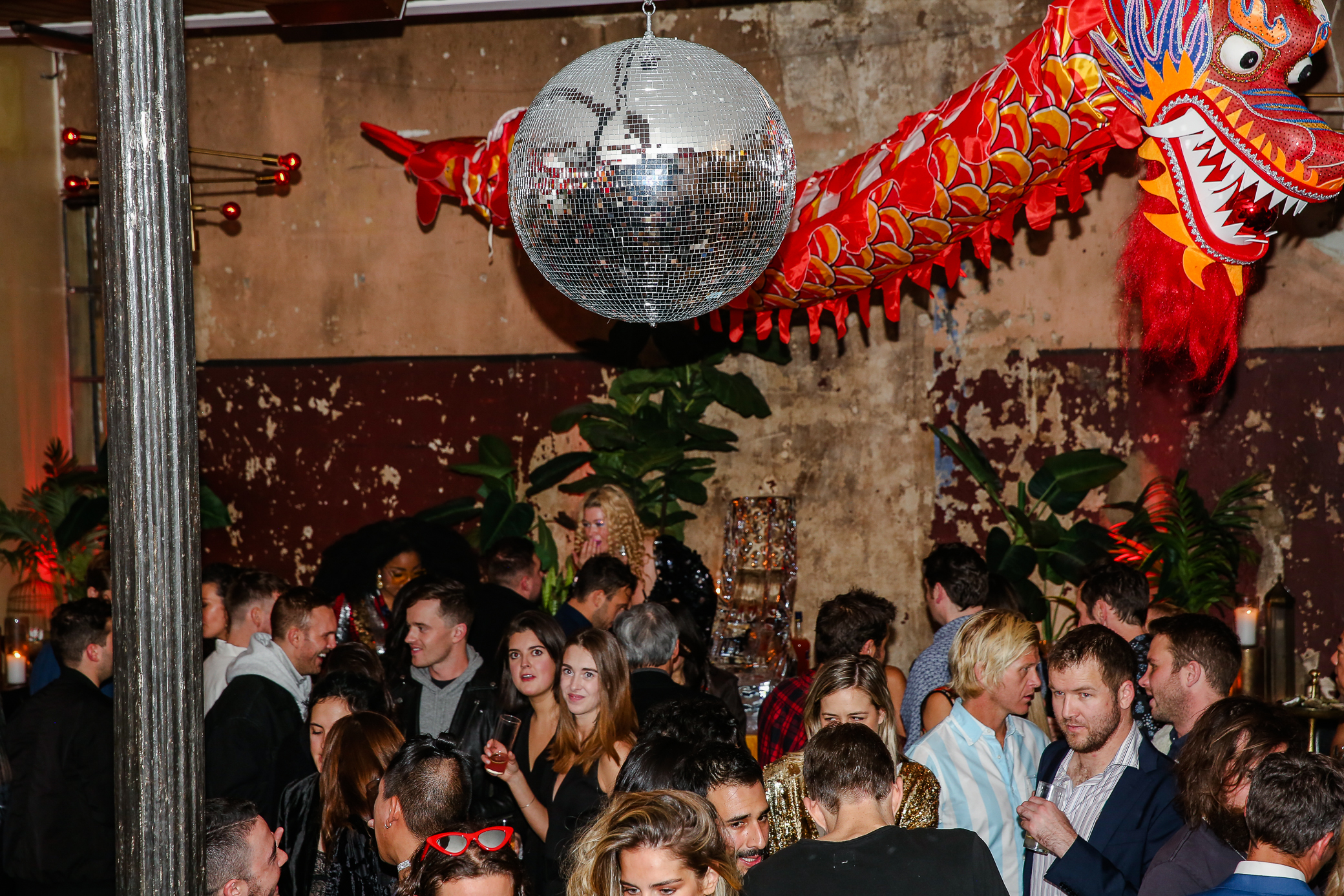 a crowd of people having fun at a party