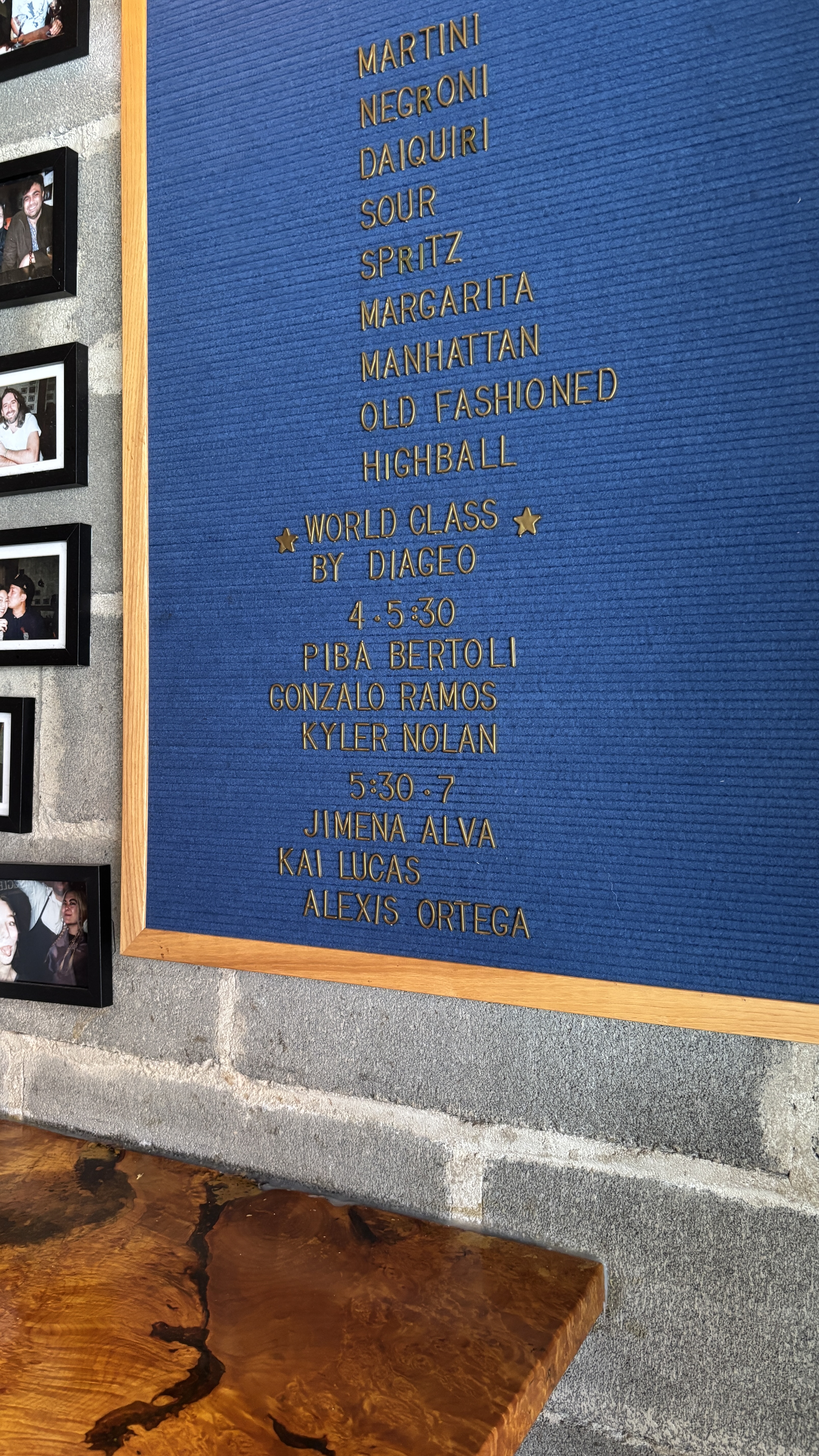 a blue board with gold text on it