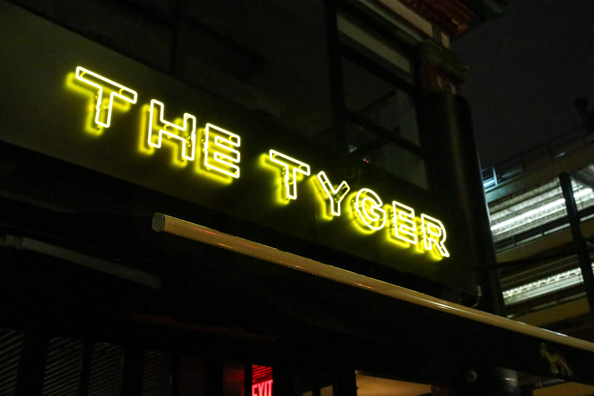 a neon sign outside of a building