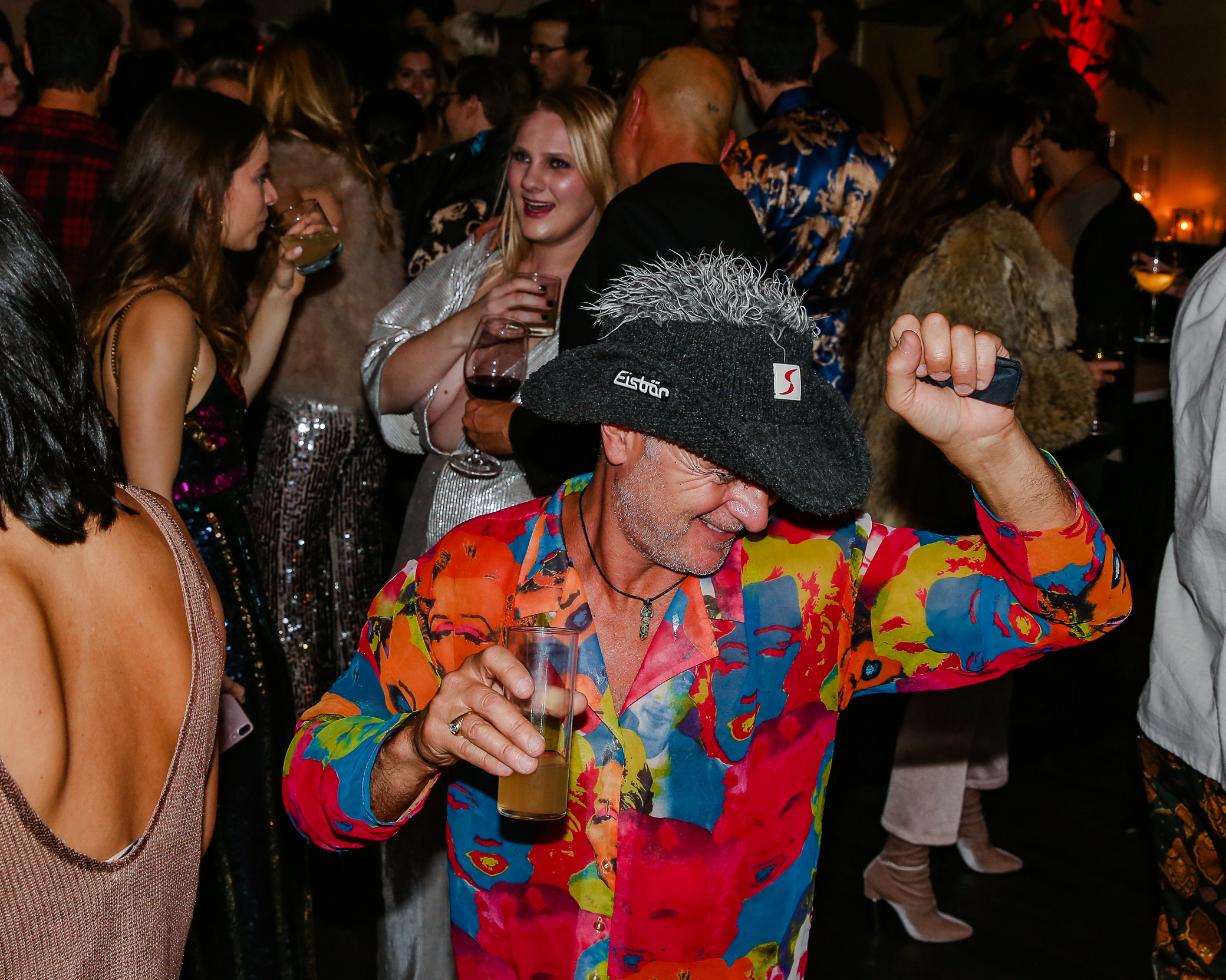 a group of people dancing at a party