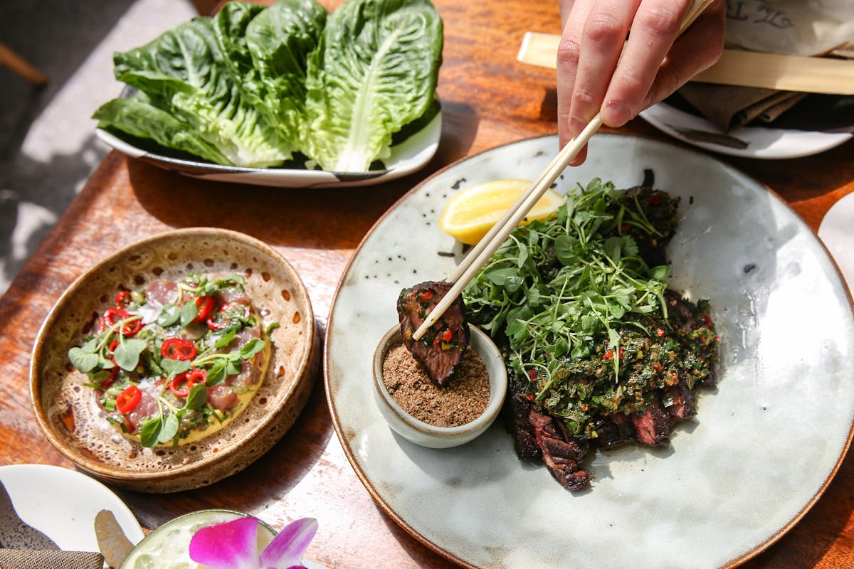 different plates of food on a wooden a table