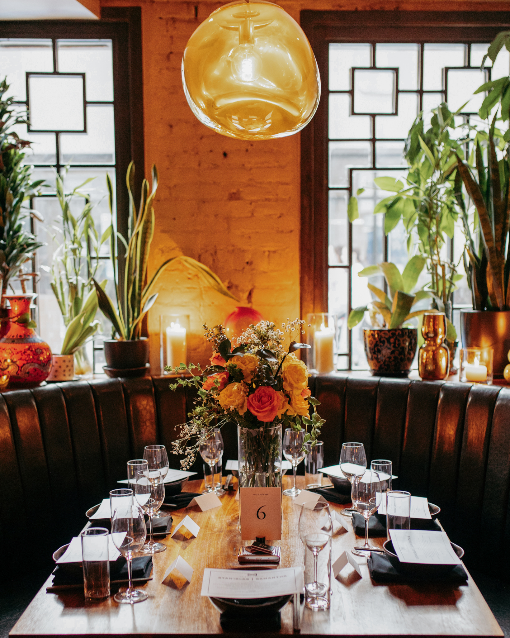 a vase of flowers on a dining table