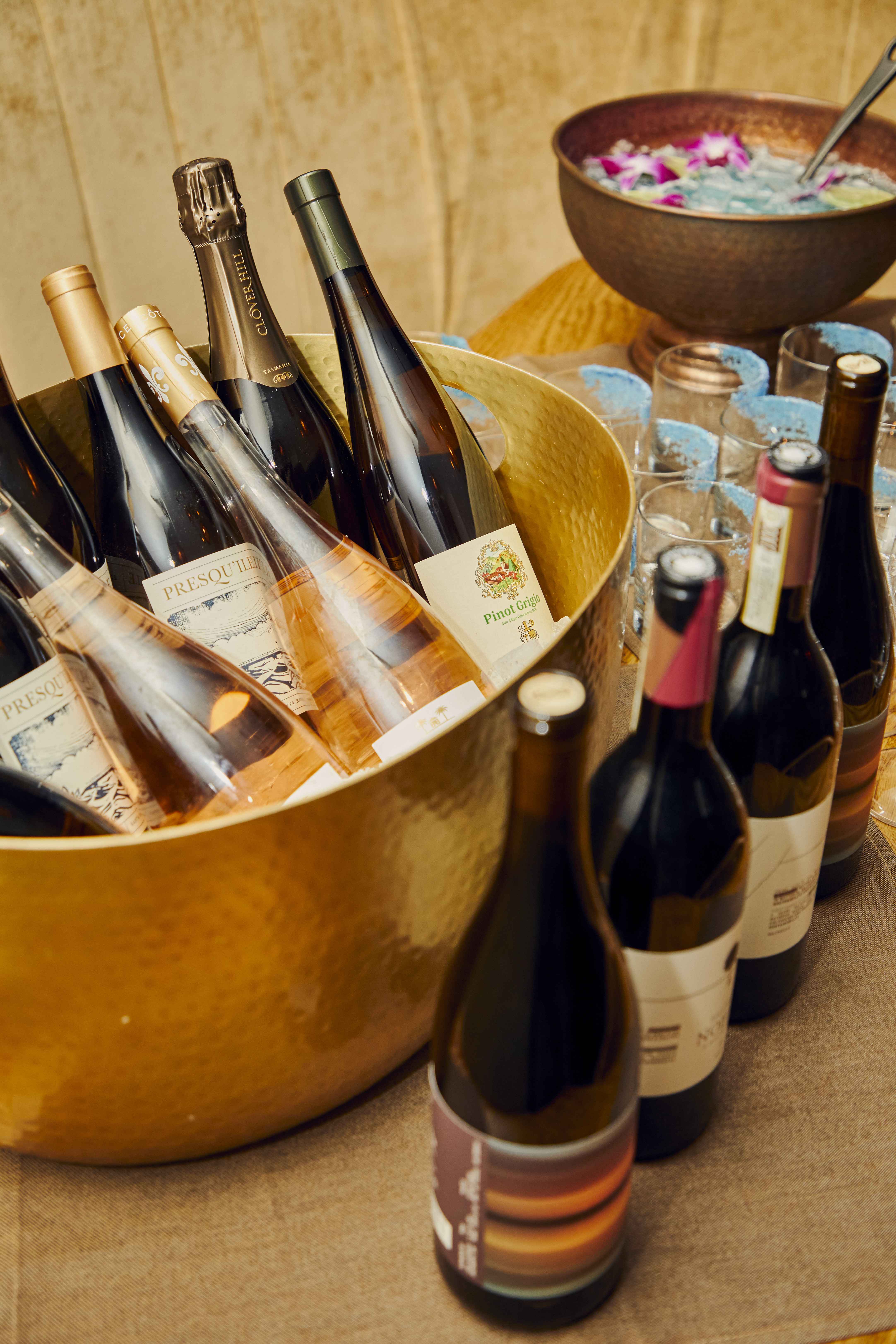 a gold bucket of wine bottles