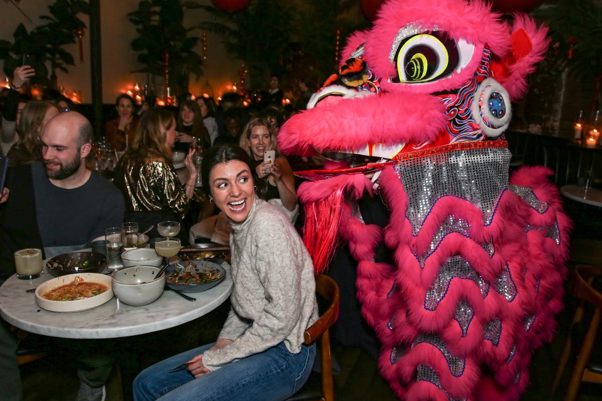 a Chinese dragon entertaining a crowd of people