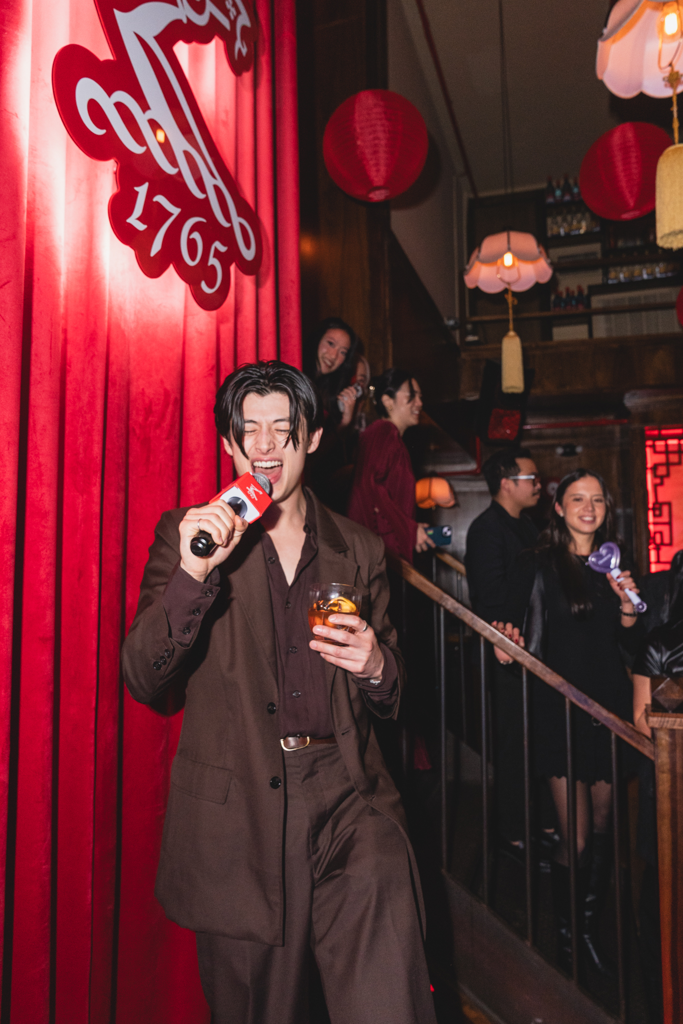 a man singing into a microphone