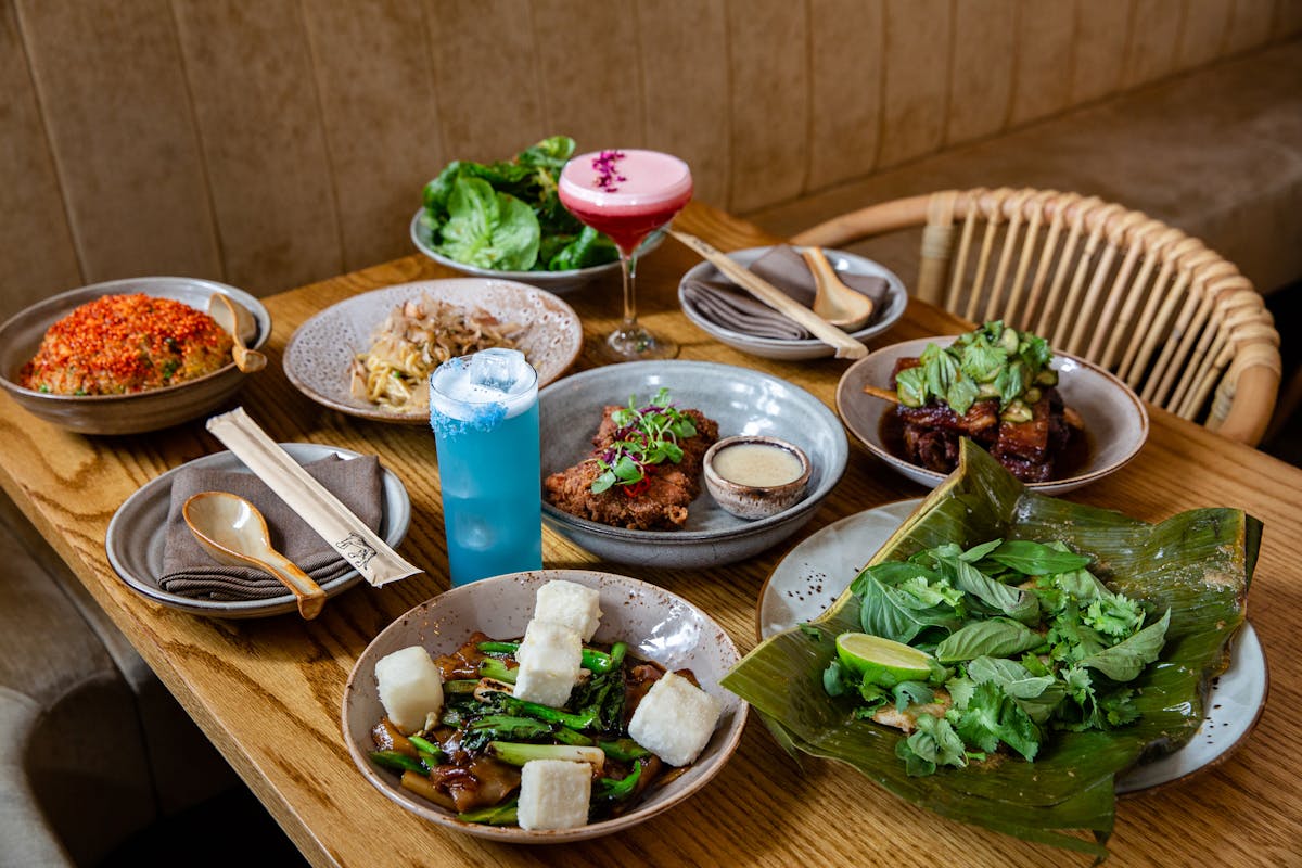 a plate of food and drinks on a wooden table