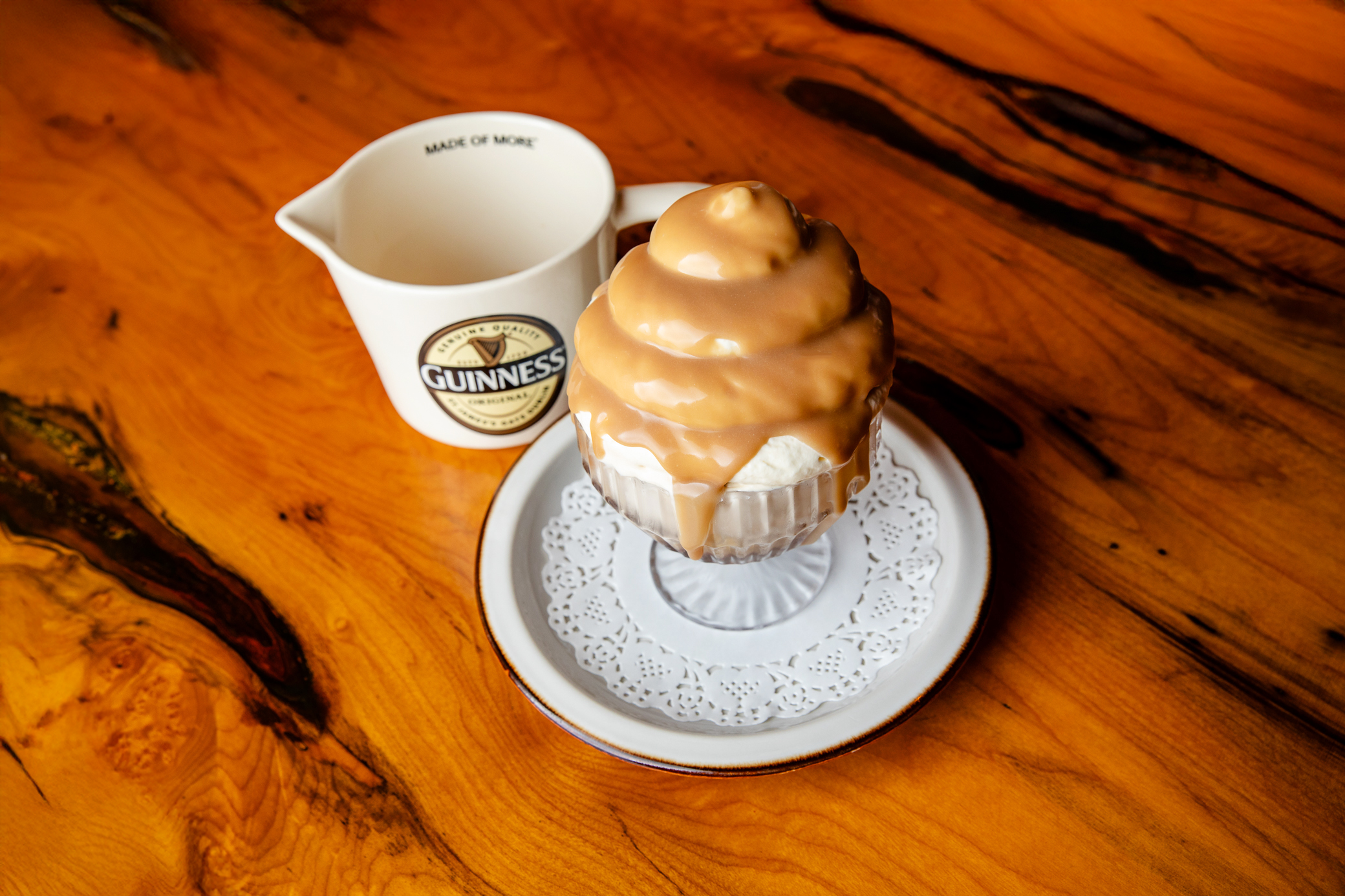 a cup of coffee sitting on top of a wooden table