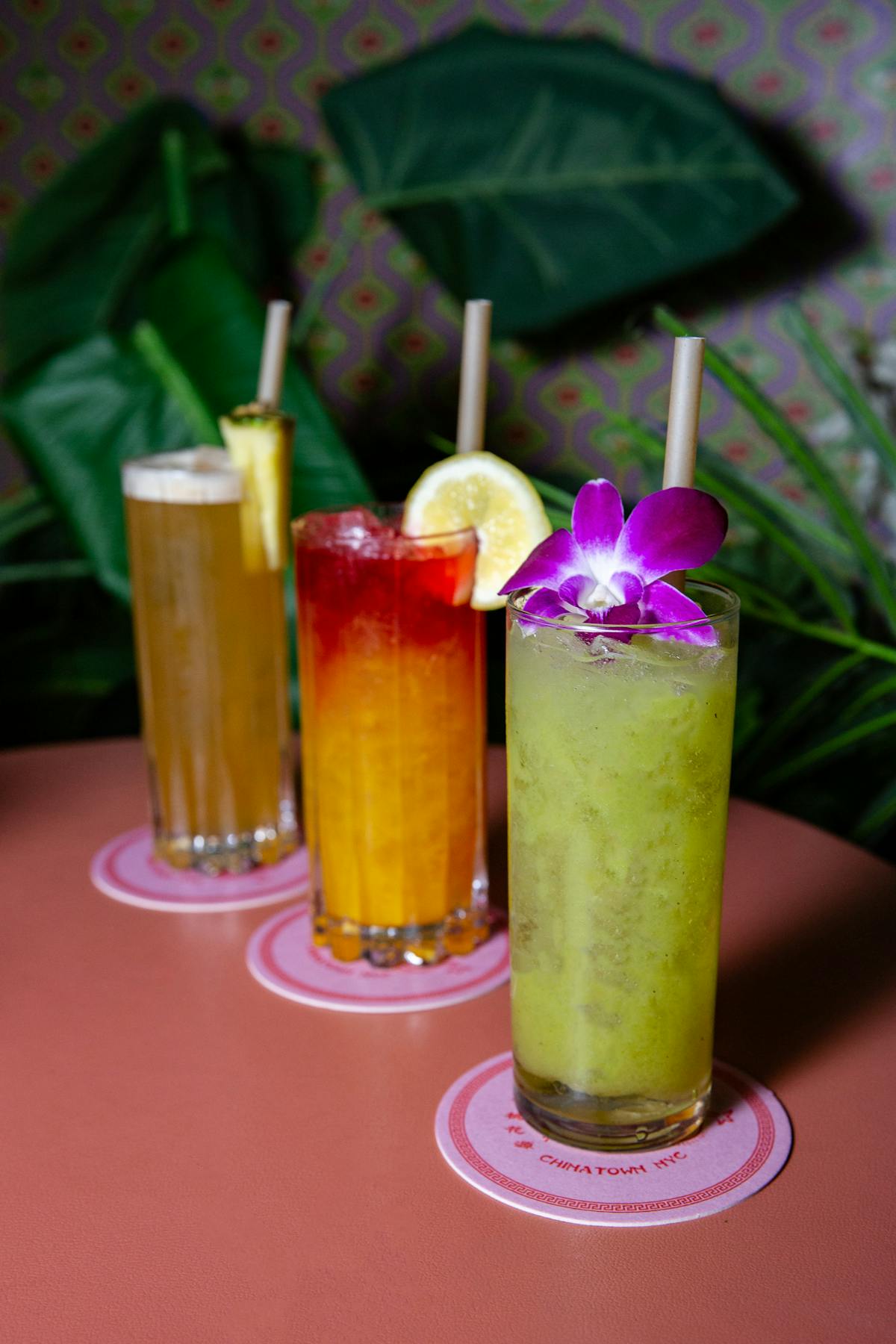 a group of cocktail drinks