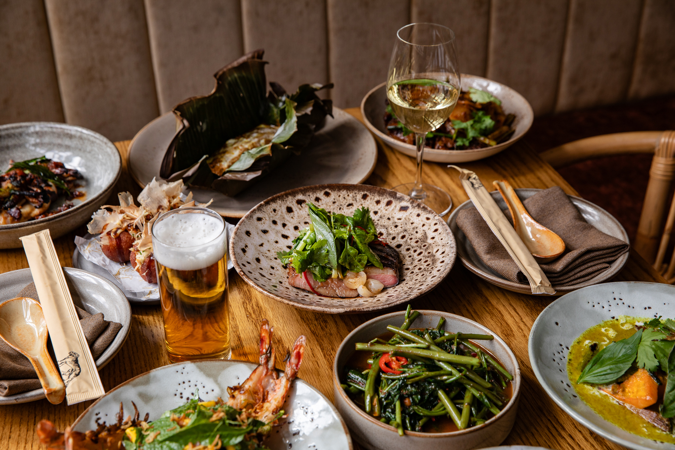 a bowl of salad on a plate on a table