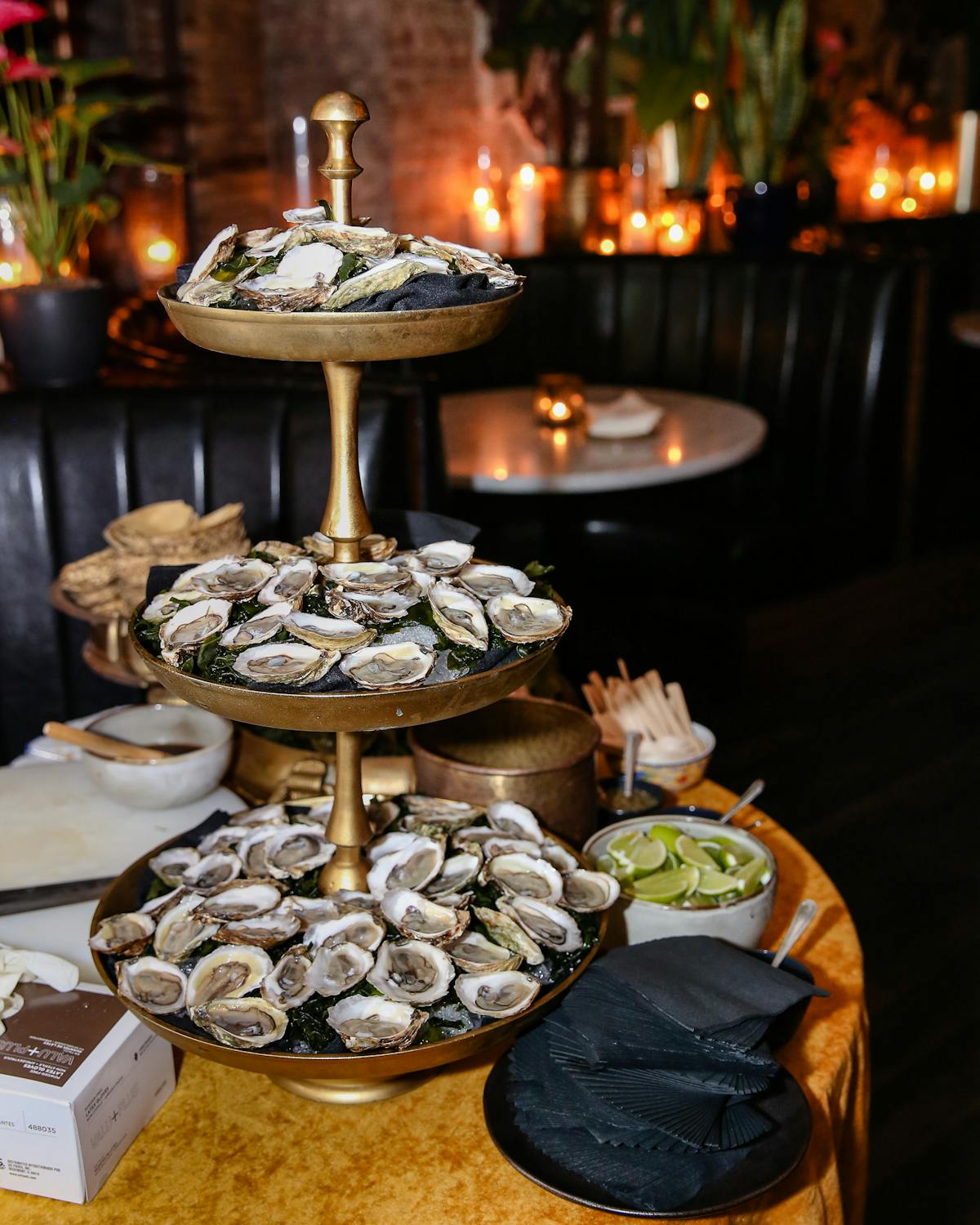 a three tiered serving tray filled with food