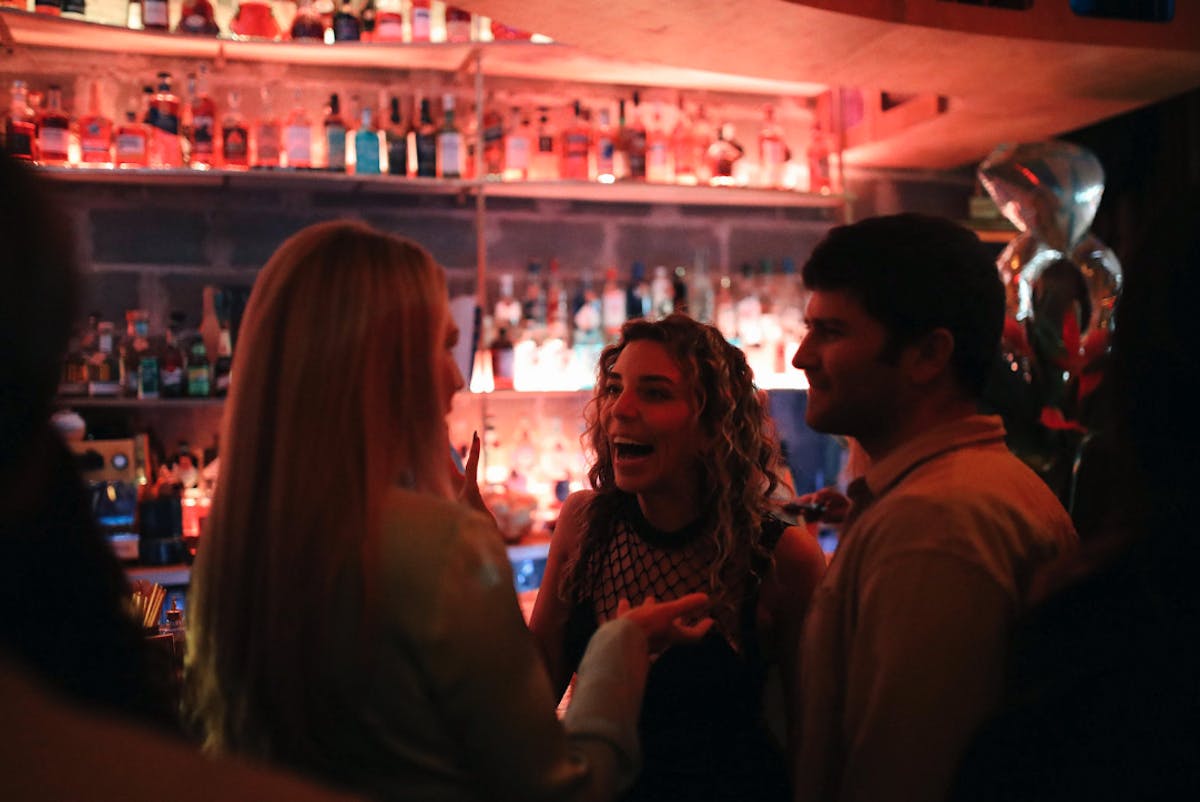 a group of people laughing at a party