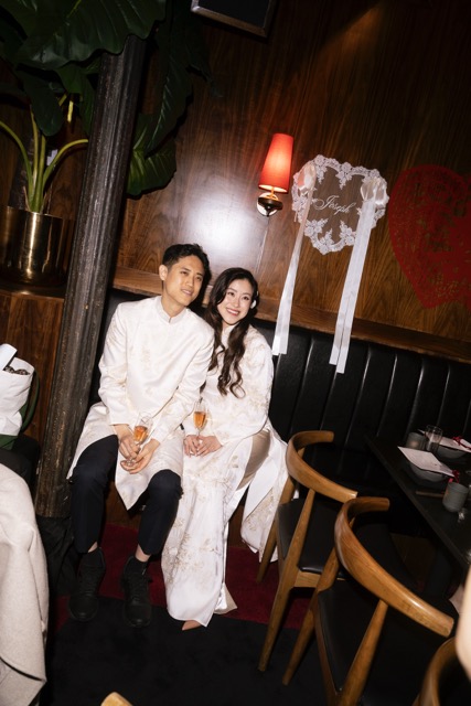 a man and woman sitting in a restaurant