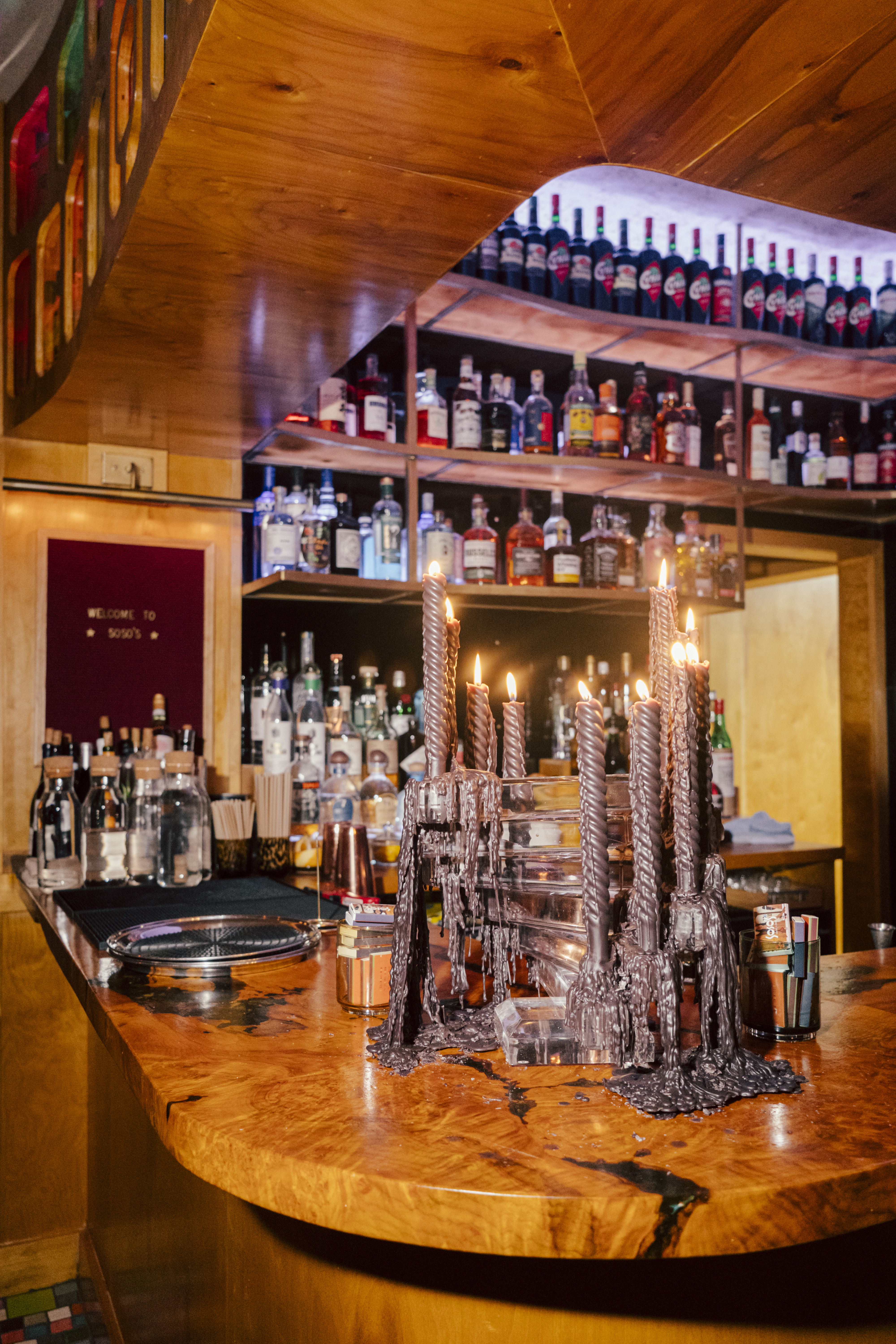 a bar with many bottles of alcohol