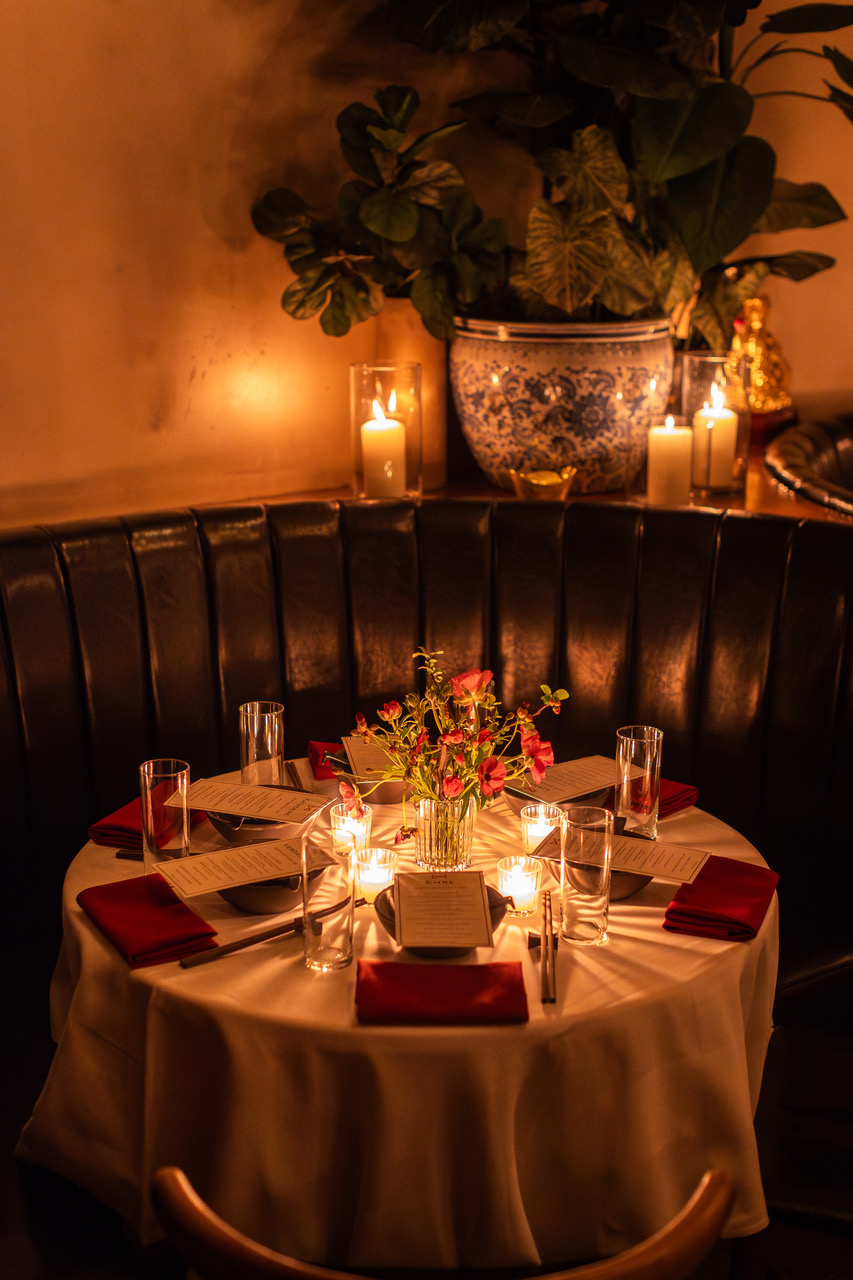 a table with candles and flowers