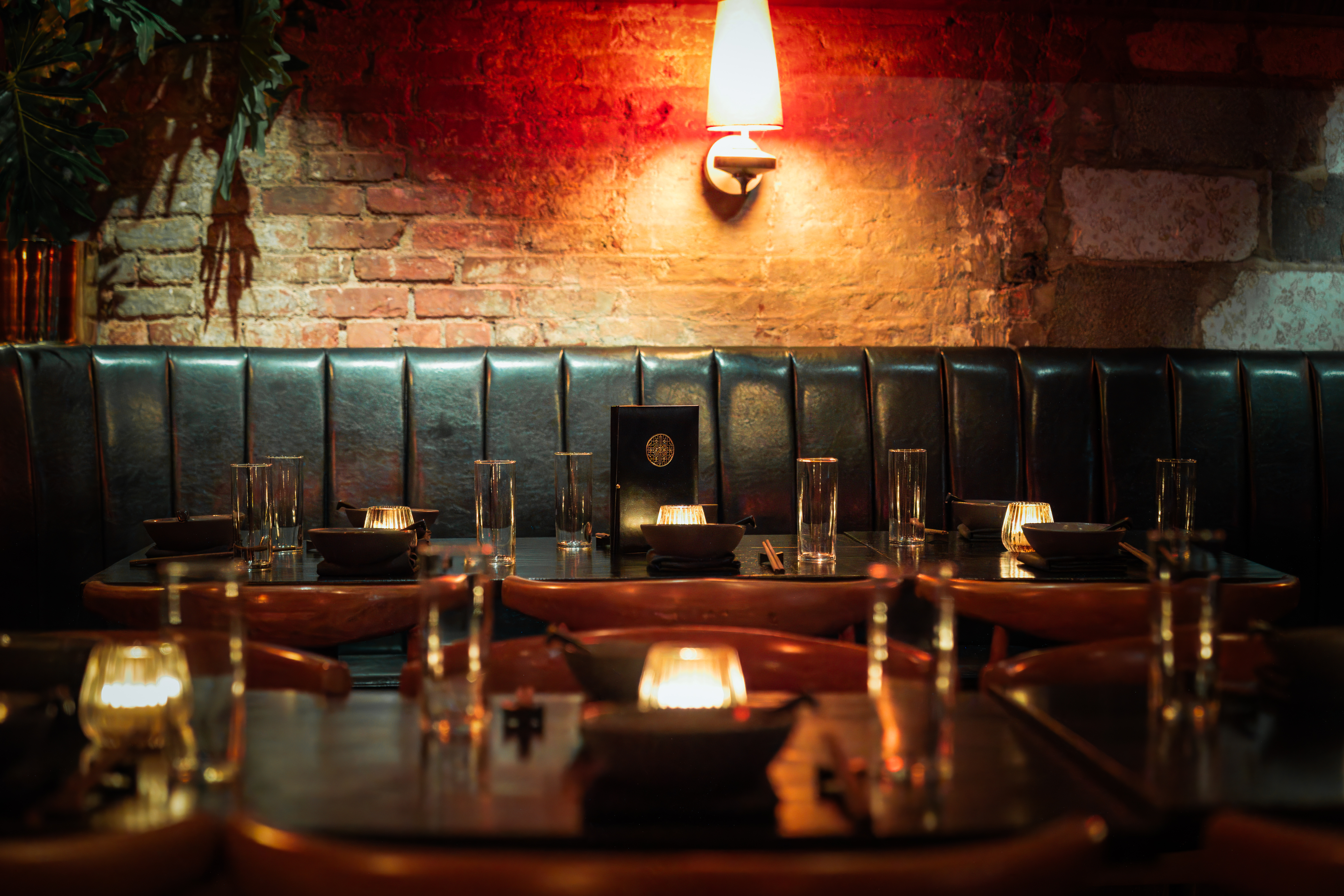 a table with candles and plates on it