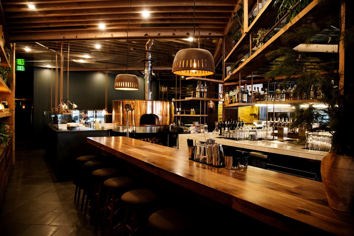 The warm, wooden bar.