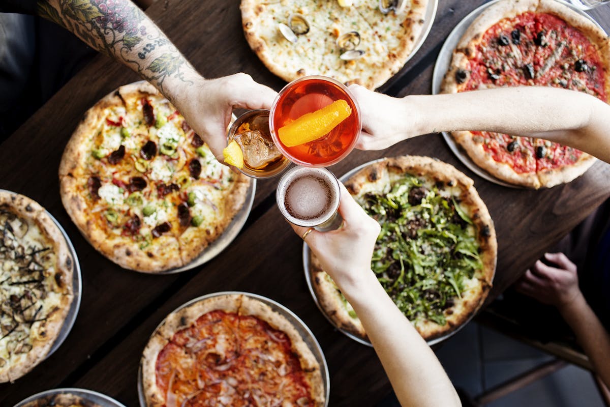 a pizza sitting on top of a plate of food