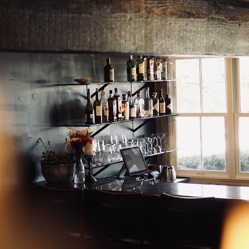 a kitchen with a table in front of a window