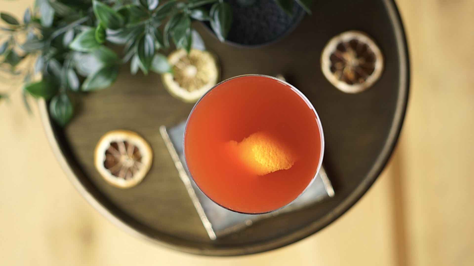 a bowl of oranges on a table
