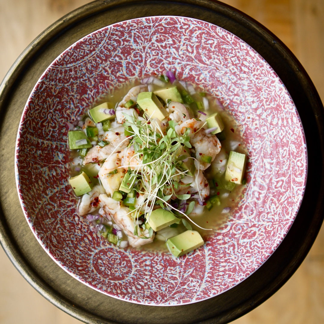 a bowl of food with broccoli