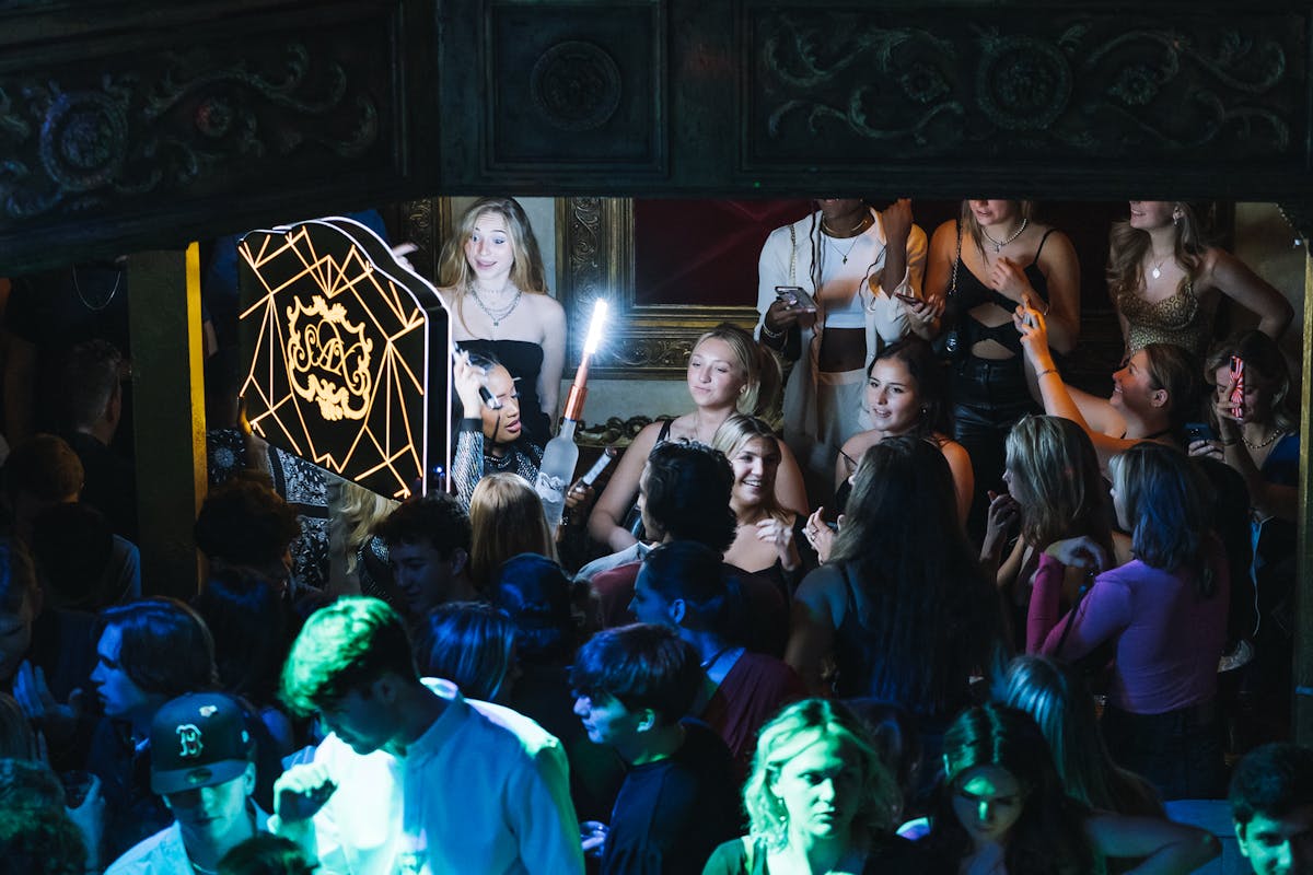 a group of people on a stage in front of a crowd