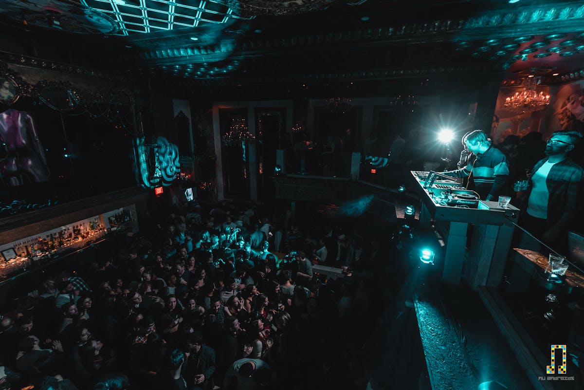 a group of people on a stage in front of a crowd