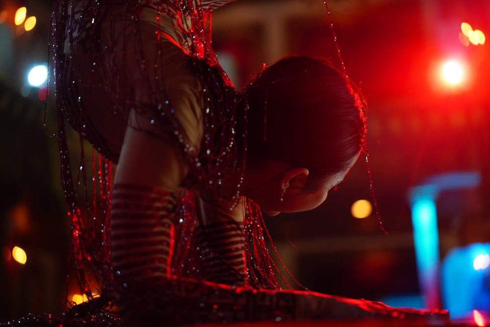 a person in a red lit up at night