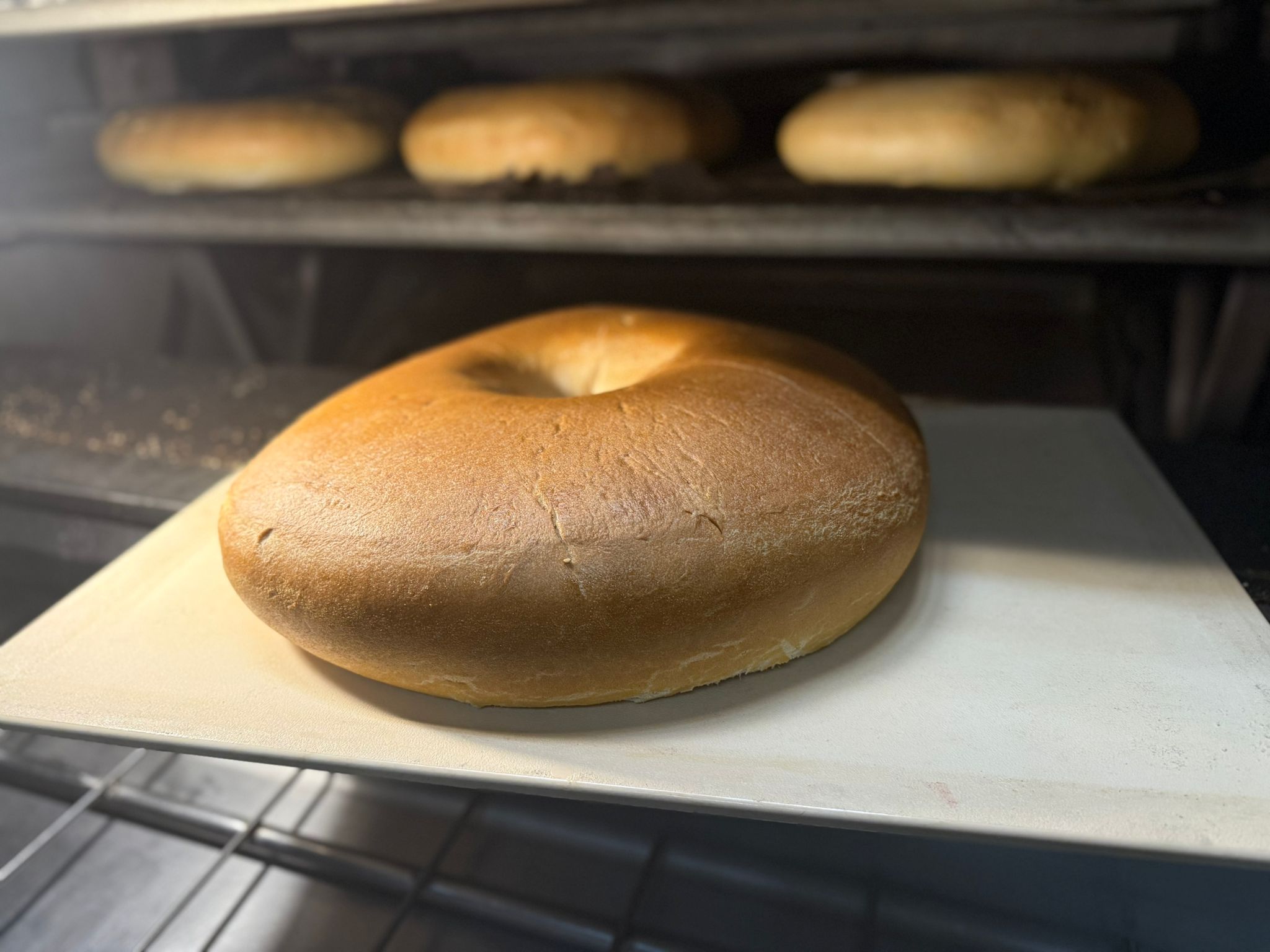 a close up of a doughnut sitting on top of an oven