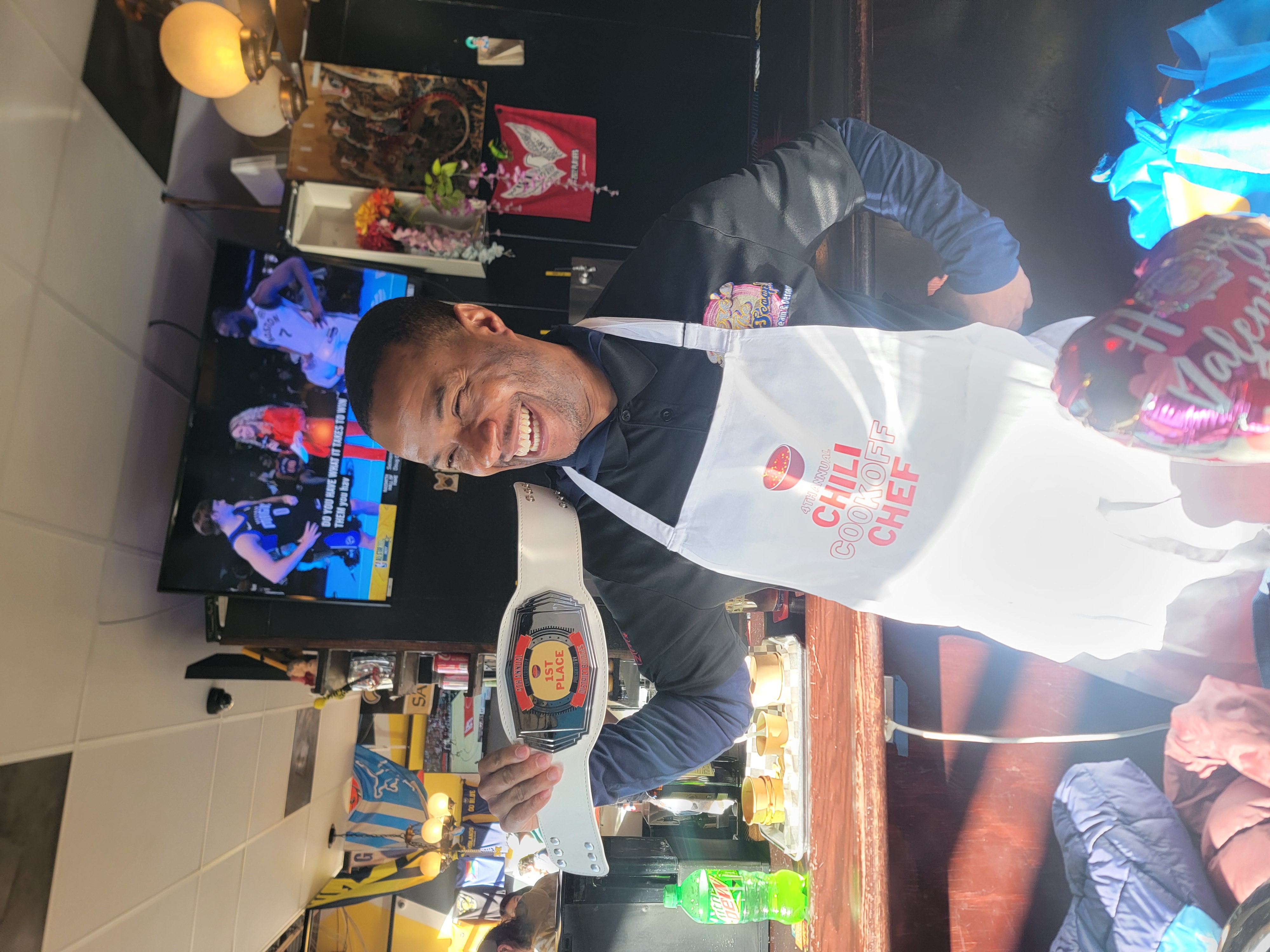 a man standing in front of a cake