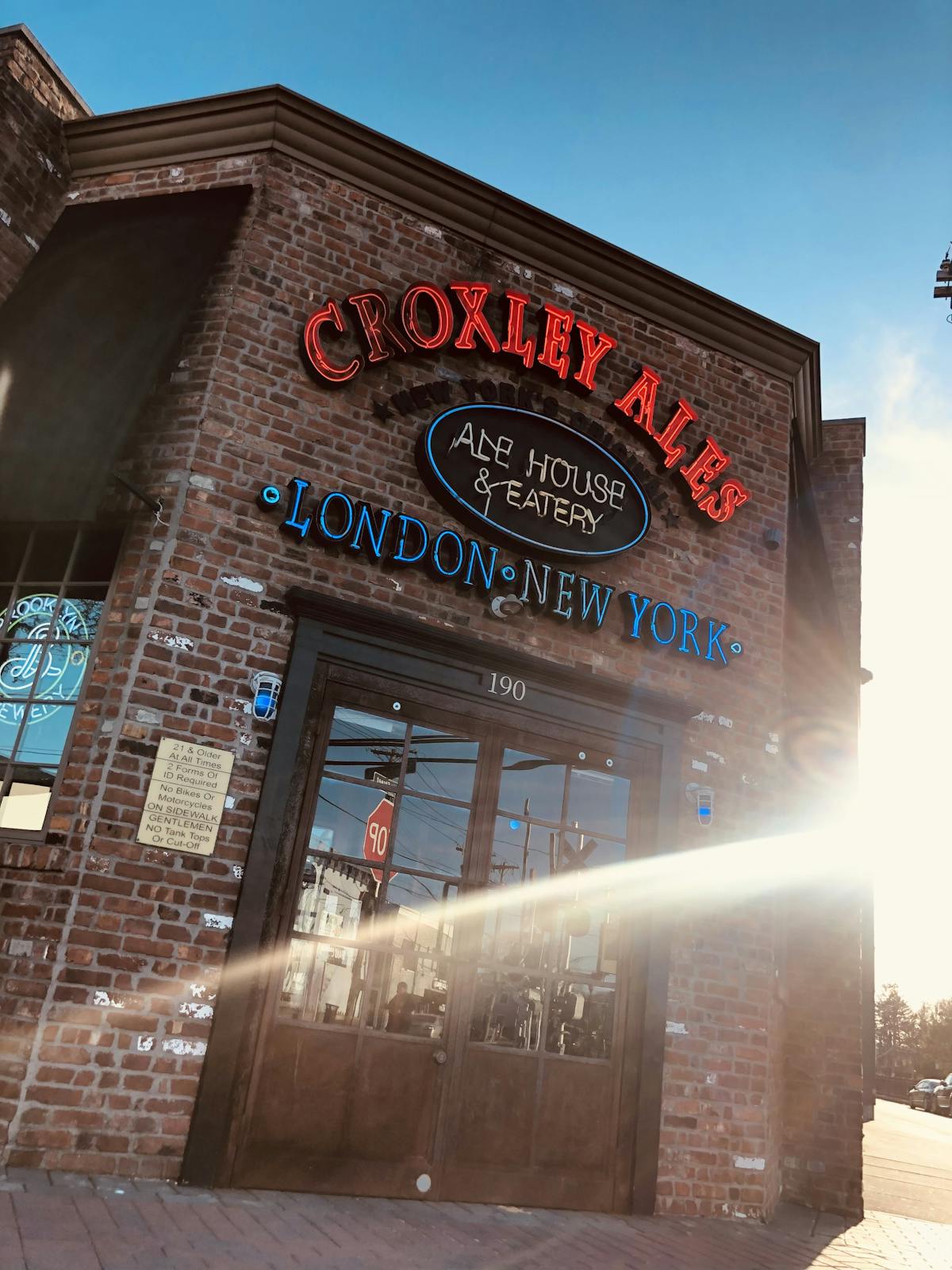 a sign above a store in a brick building