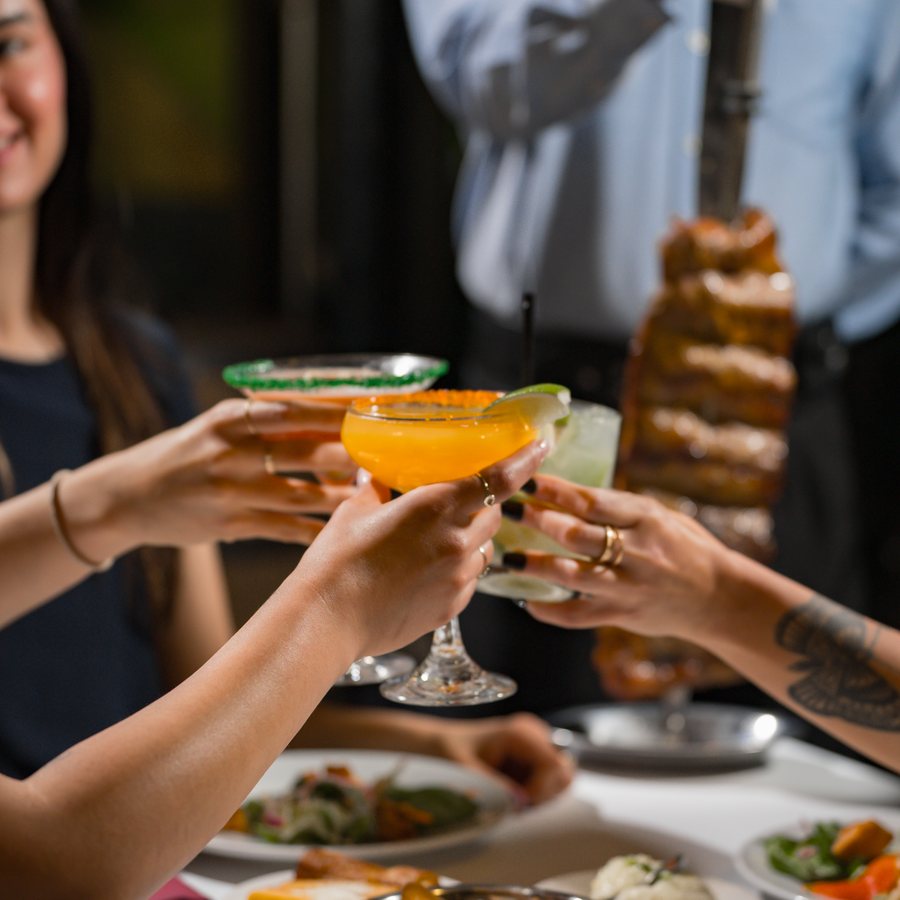 A table toasting with drinks