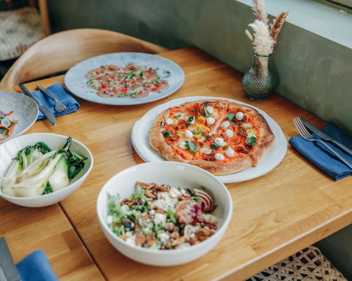 a bowl of food on a wooden table