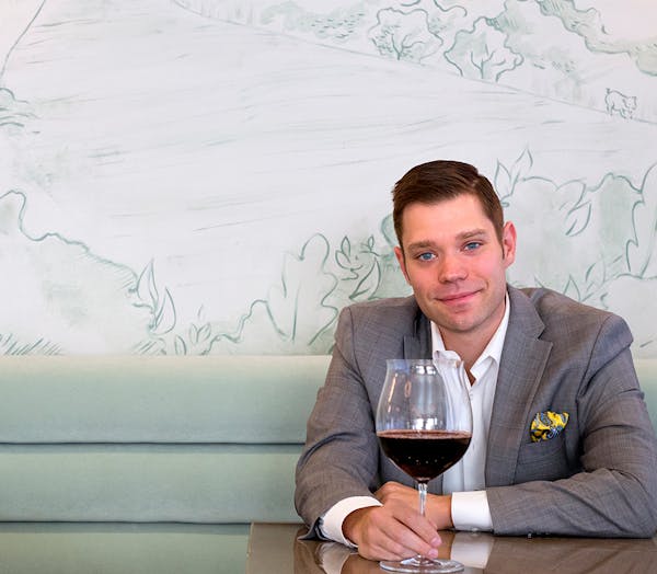 a person holding a glass of wine