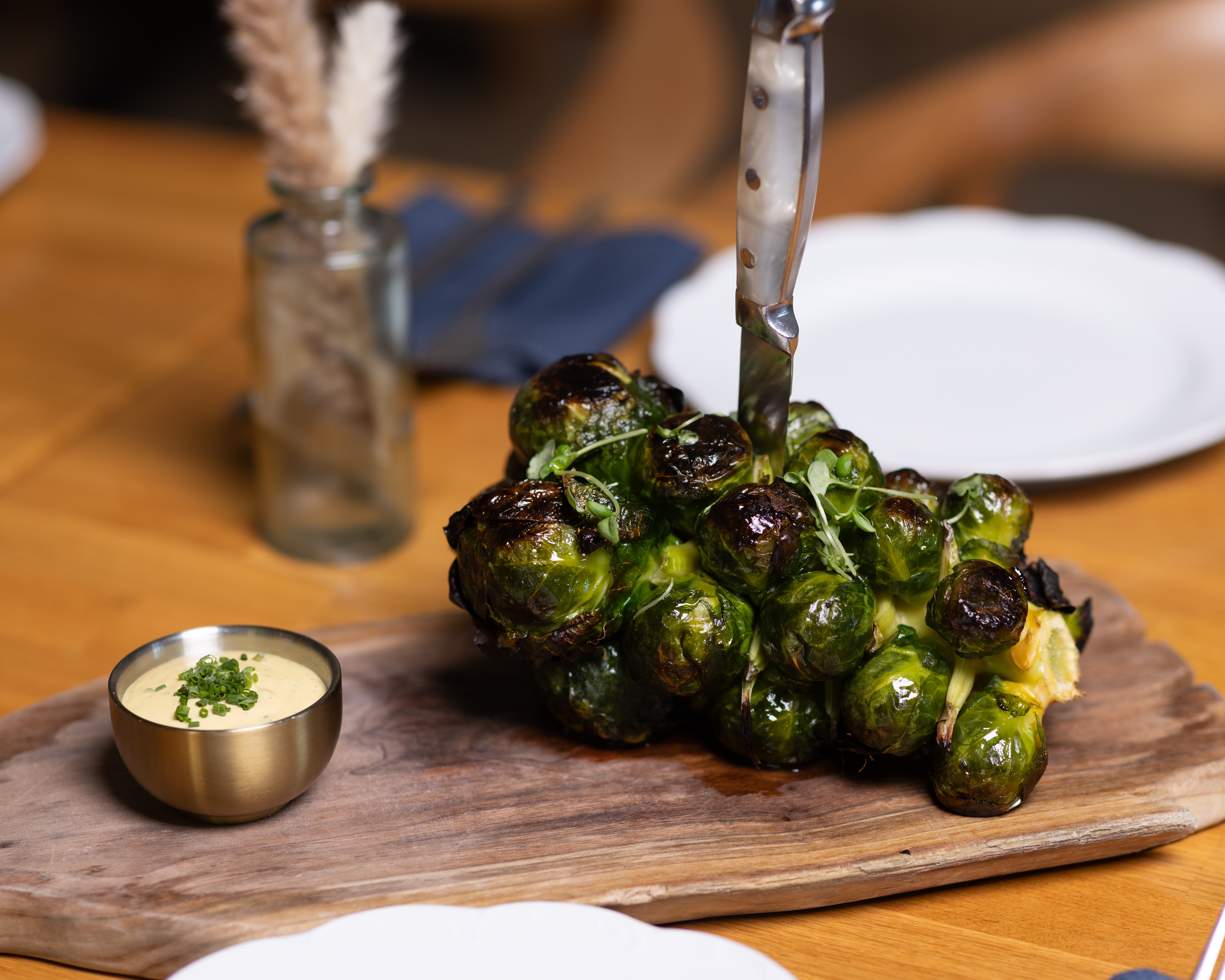 a plate of food sitting on top of a wooden cutting board