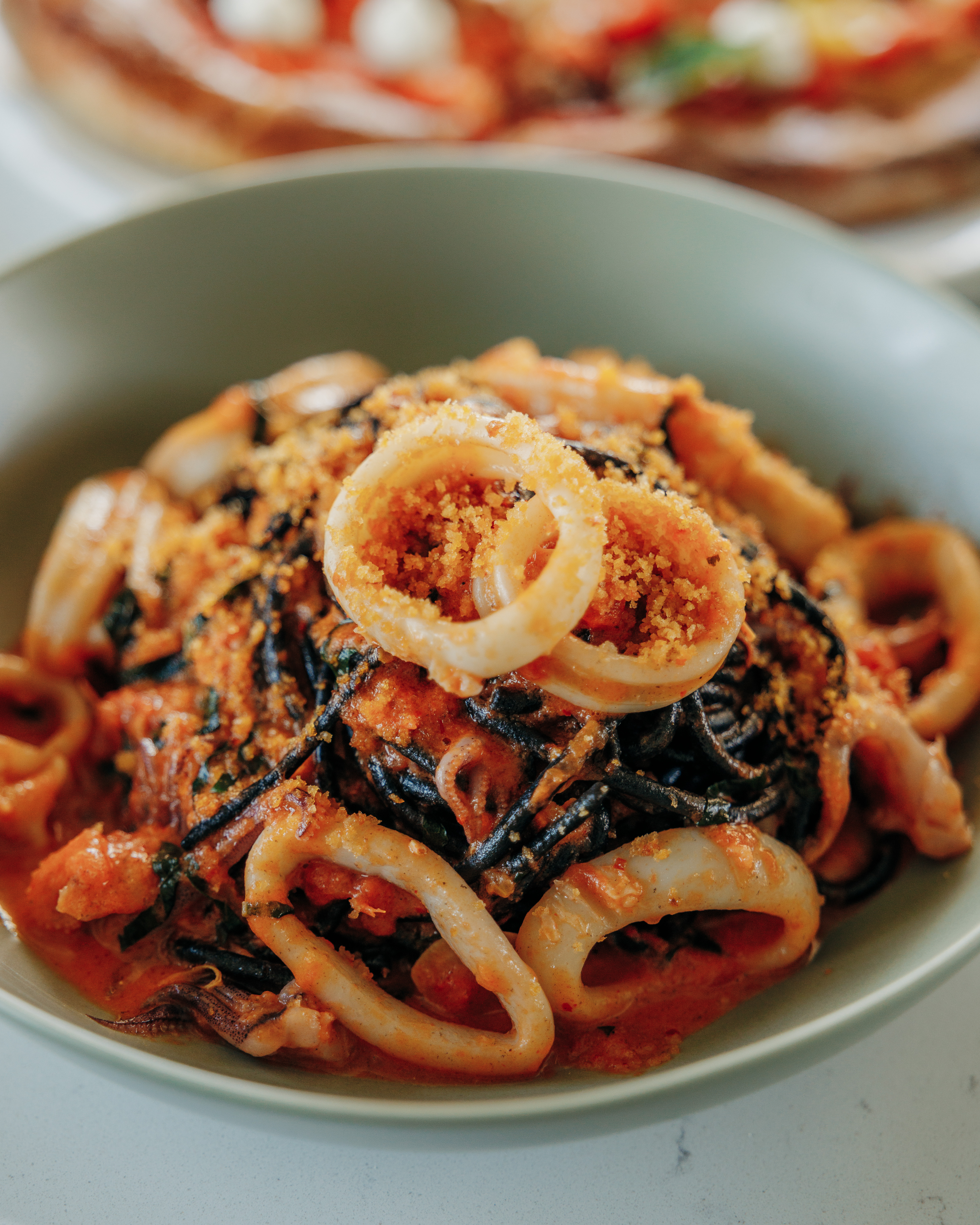 a close up of a bowl of food on a plate