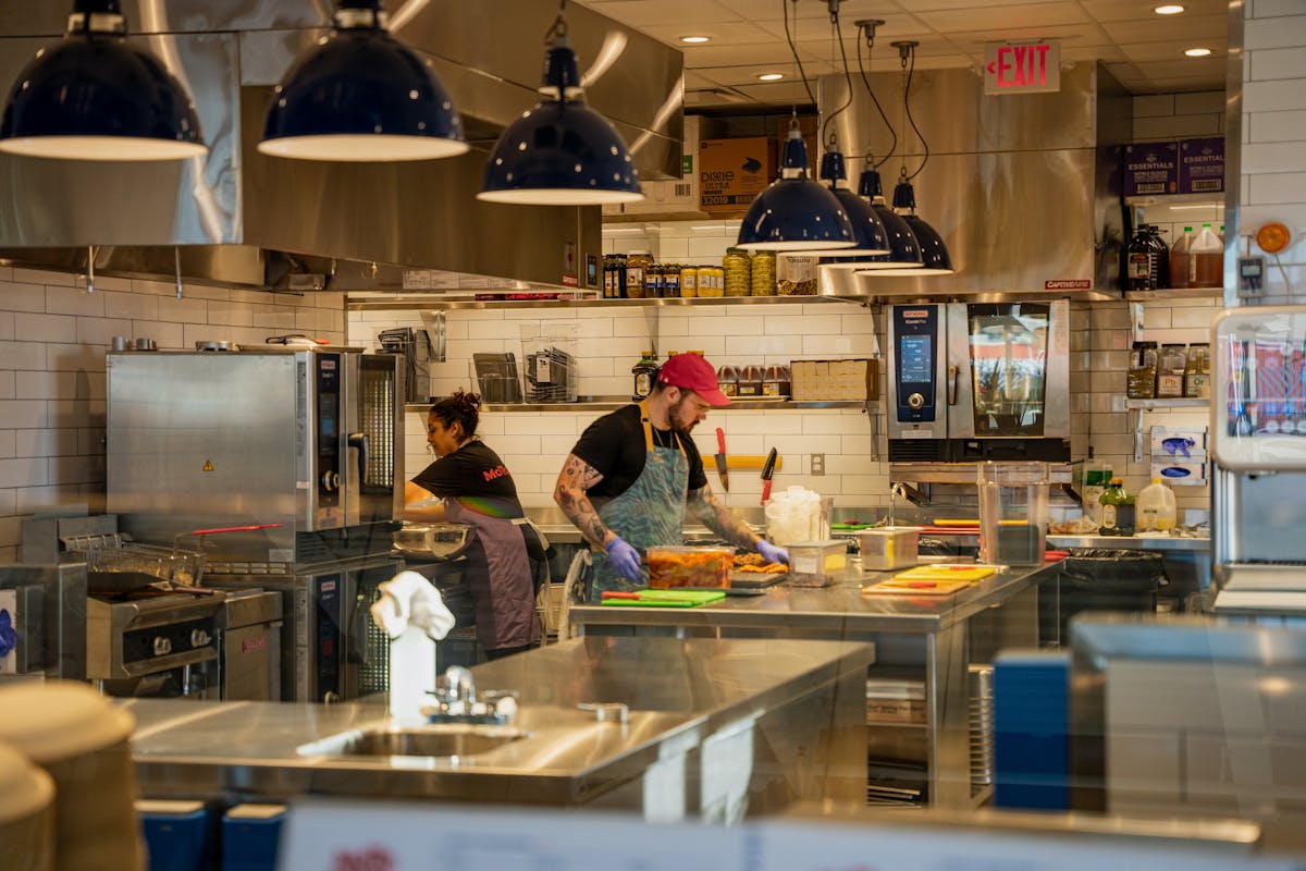 a person cooking in a kitchen preparing food