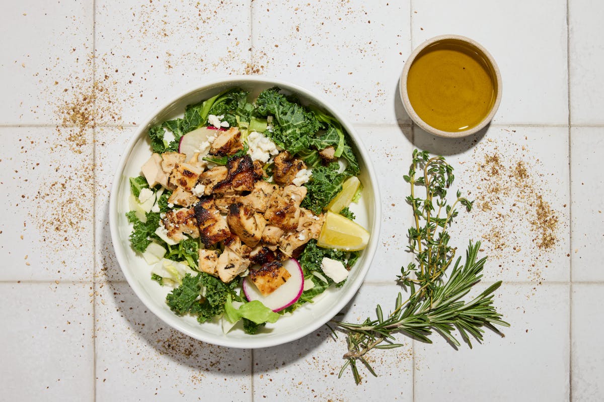 a bowl of food with broccoli