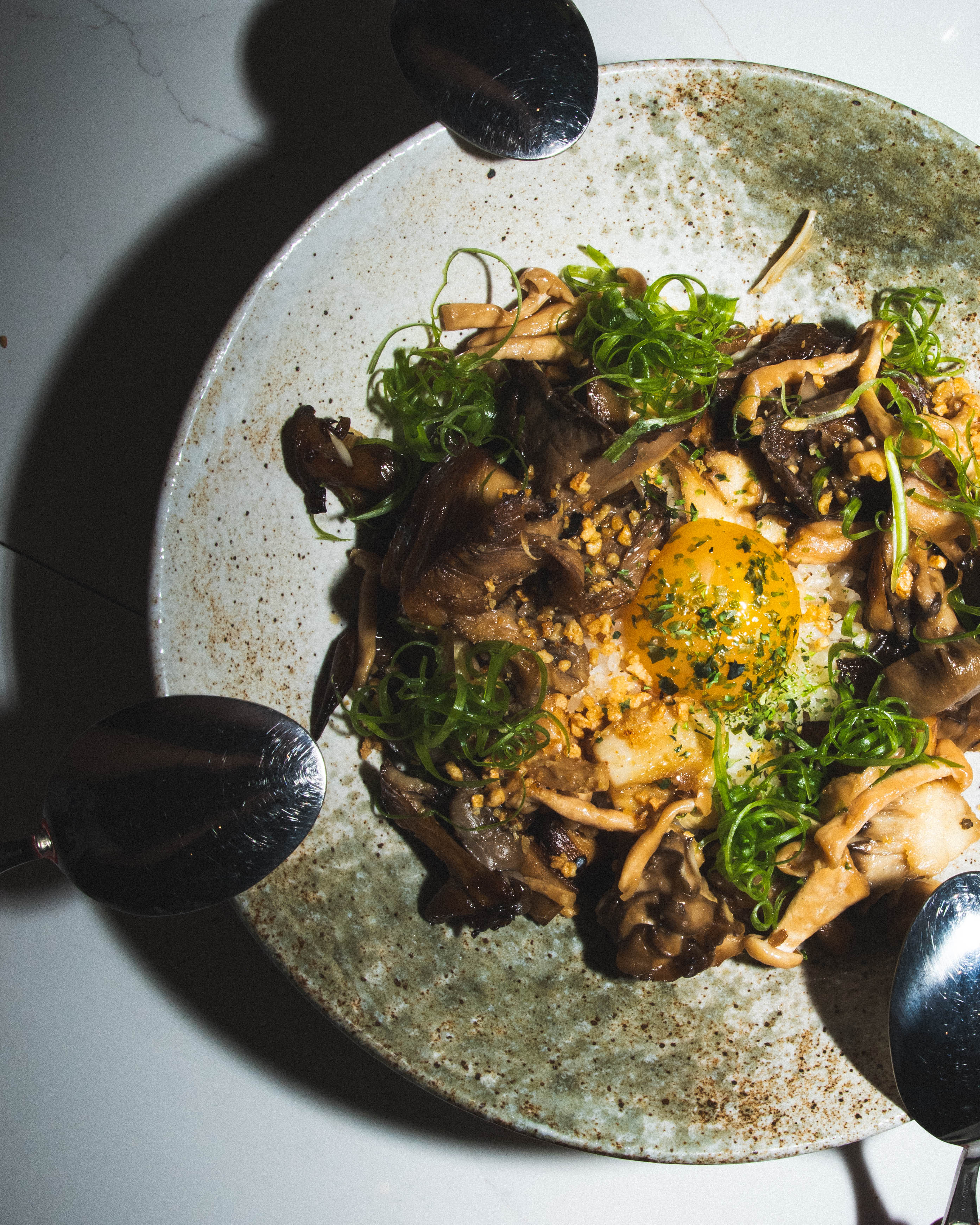 a plate of food with spoons