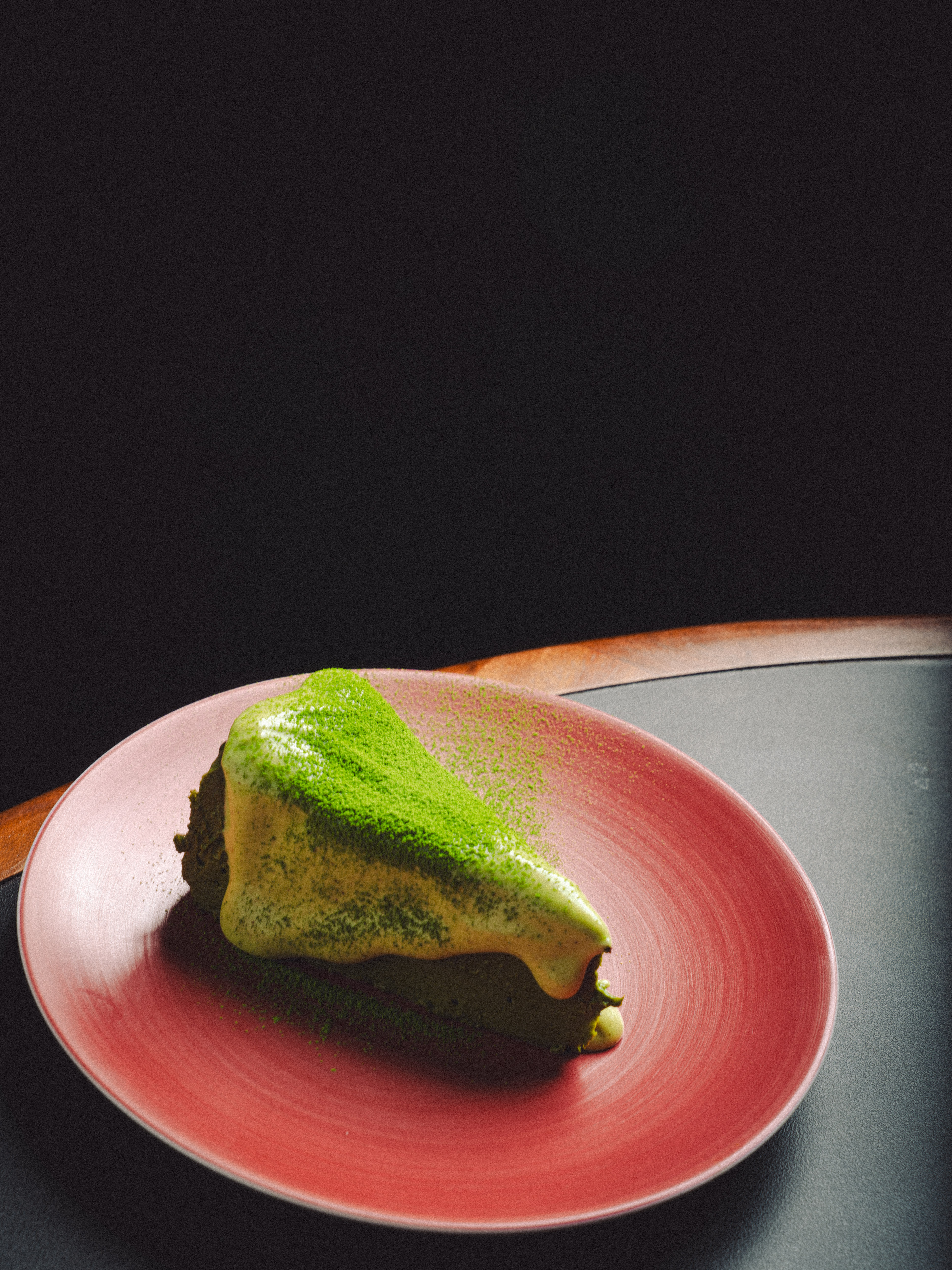 a piece of cake on a red plate