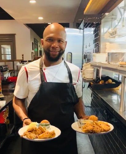 a person holding a plate of food