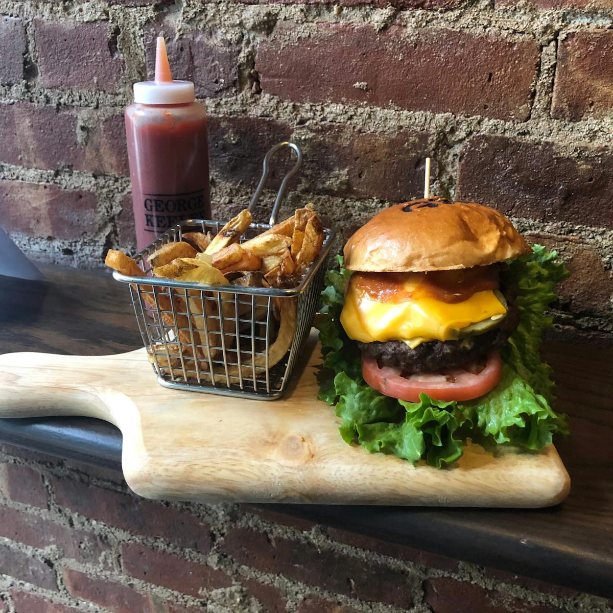 a sandwich sitting on top of a wooden cutting board
