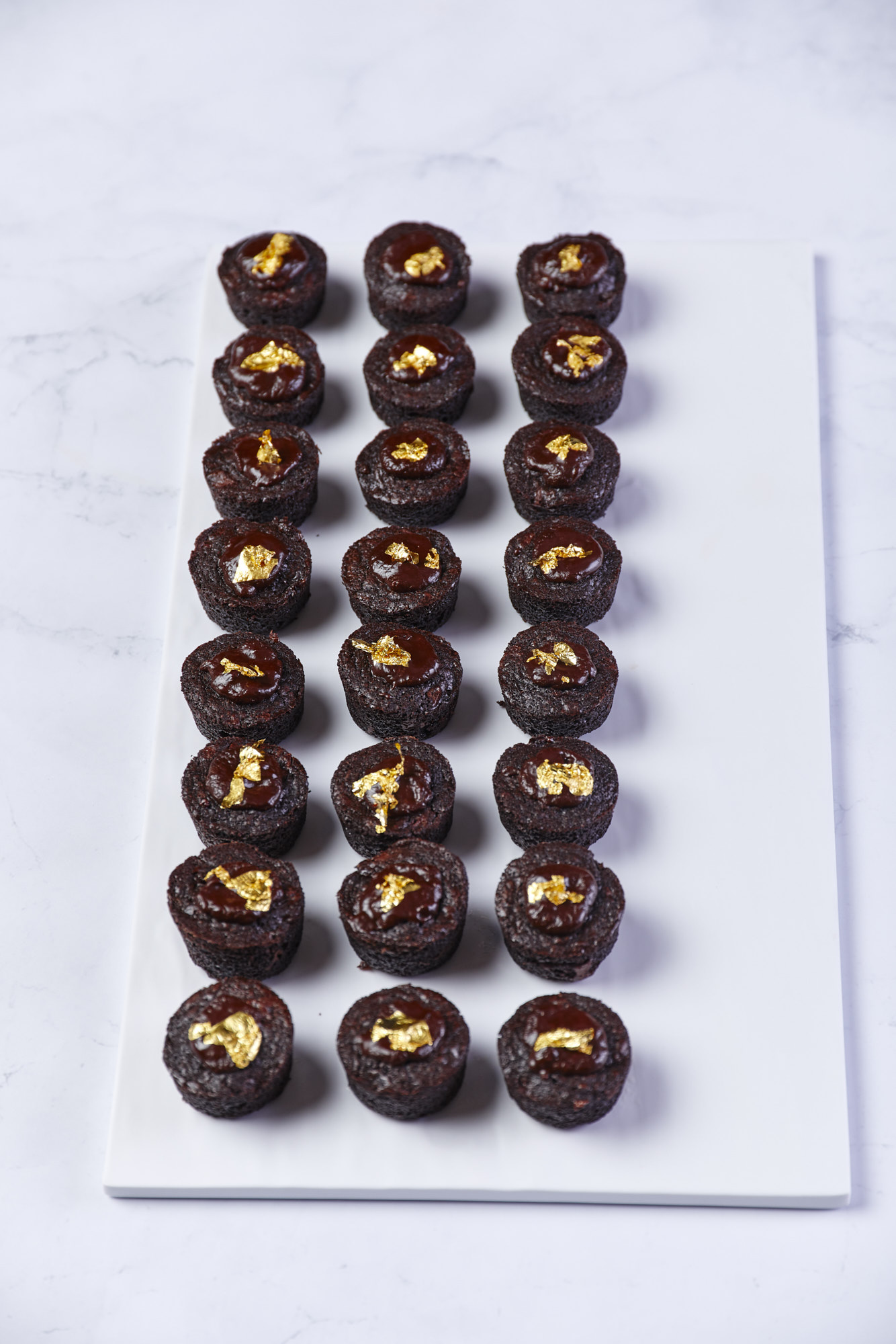 a row of chocolate cupcakes