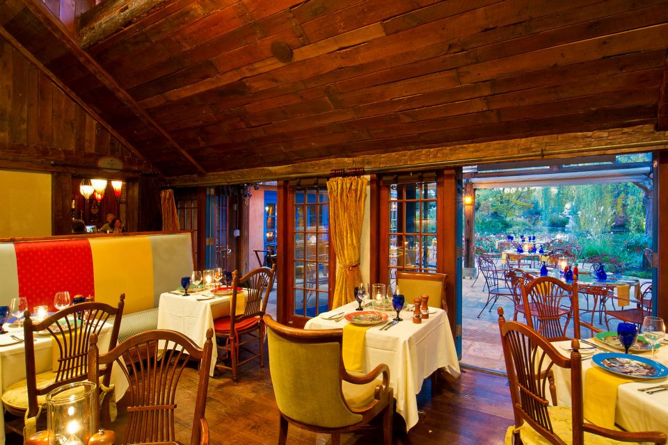 a restaurant with tables and chairs
