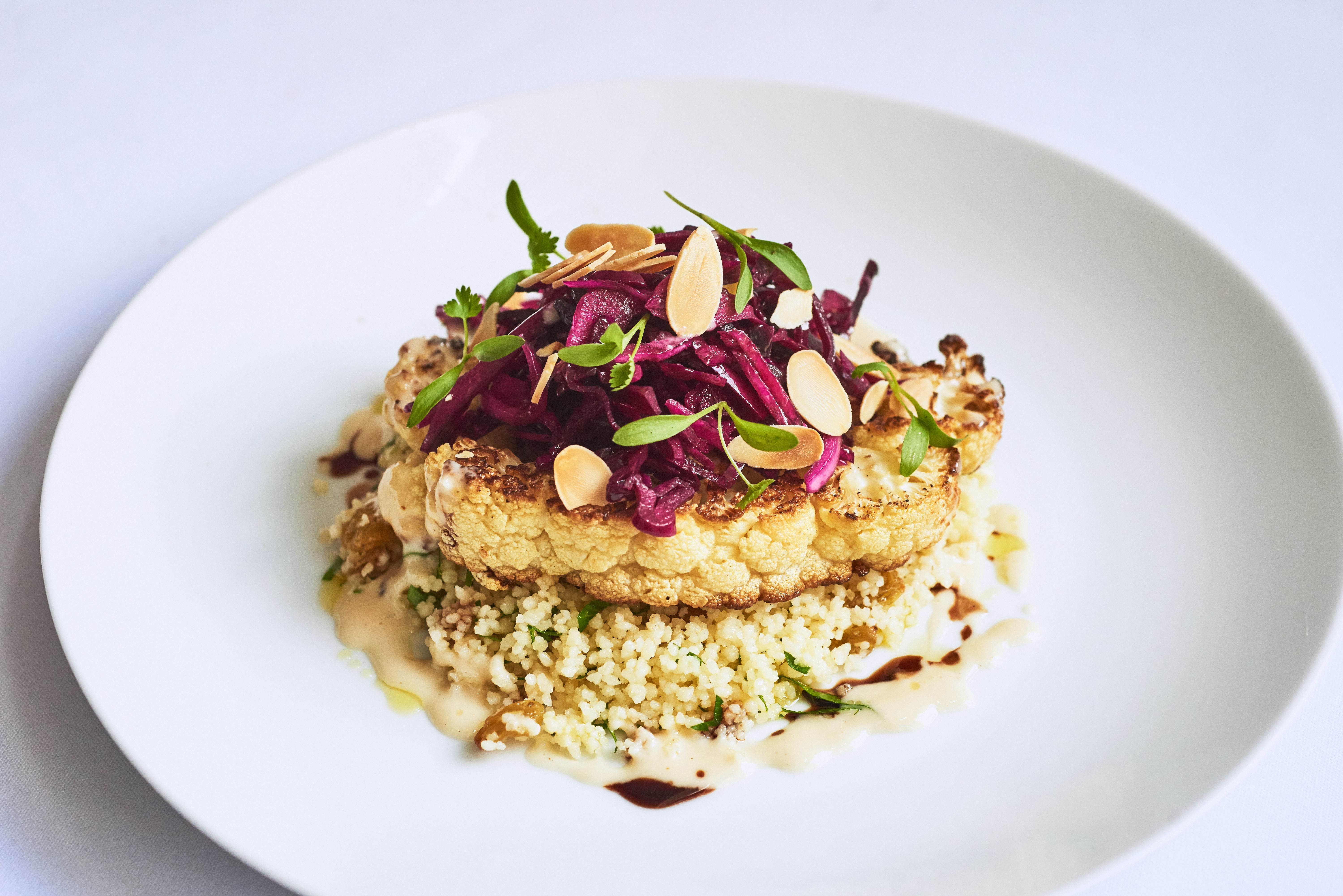 a plate of food on a white surface