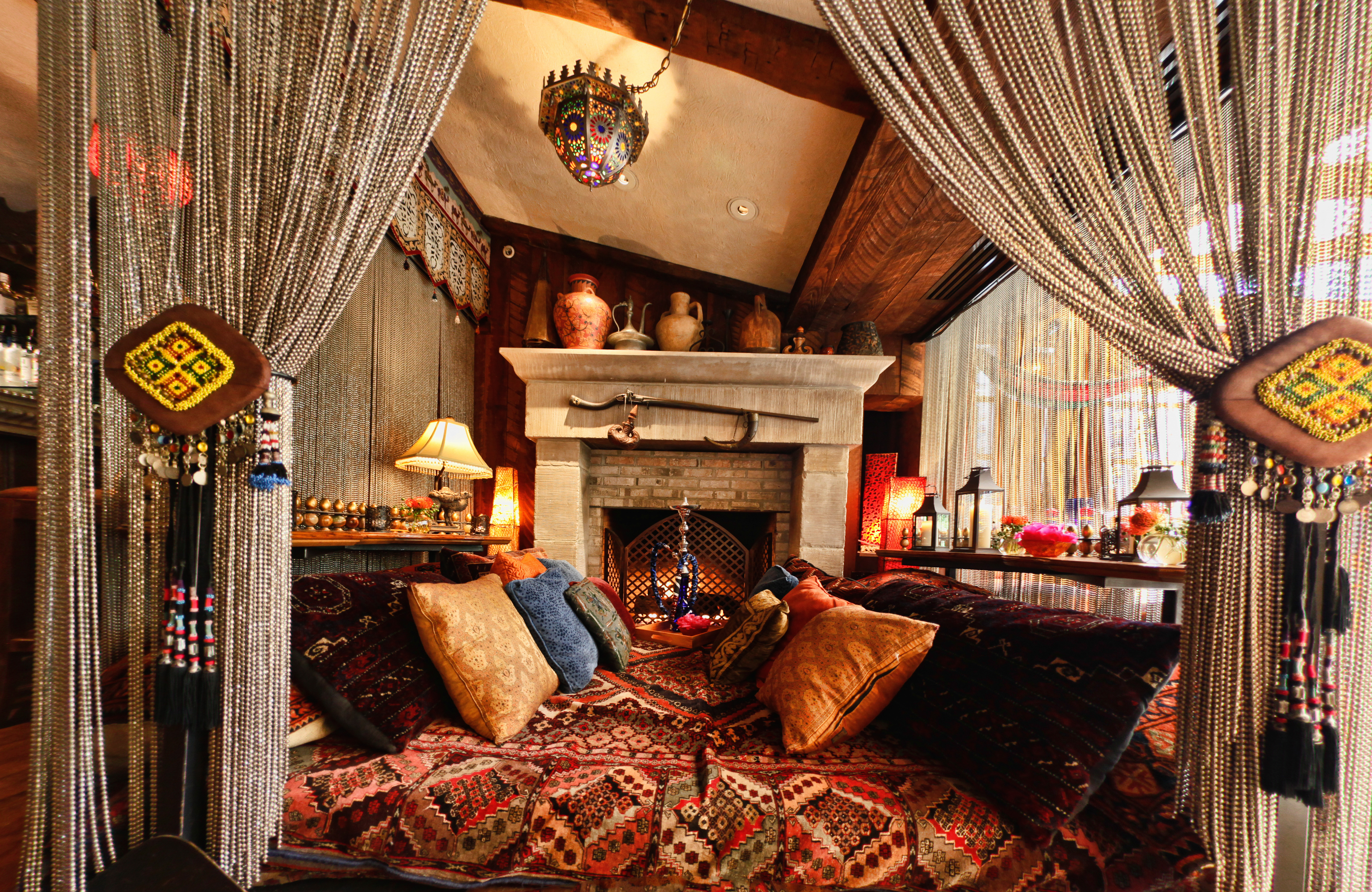 a room with a fireplace and a bed