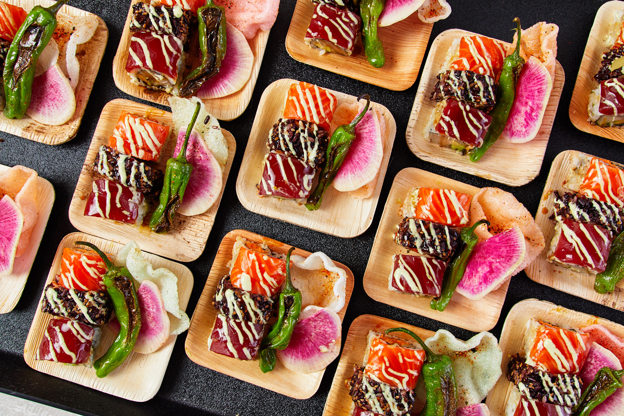 a group of wooden plates with food on them